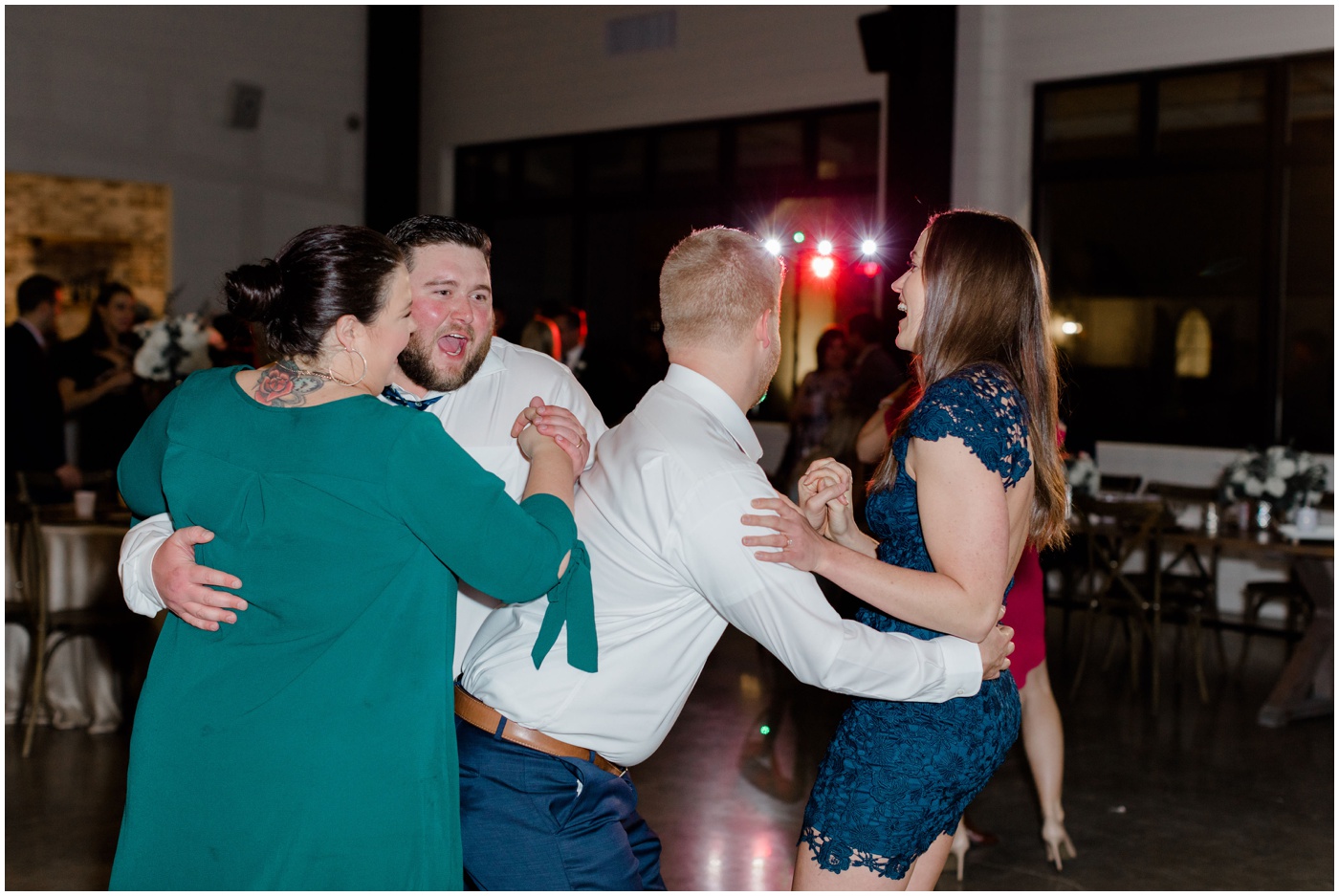 wedding guests dance at the reception
