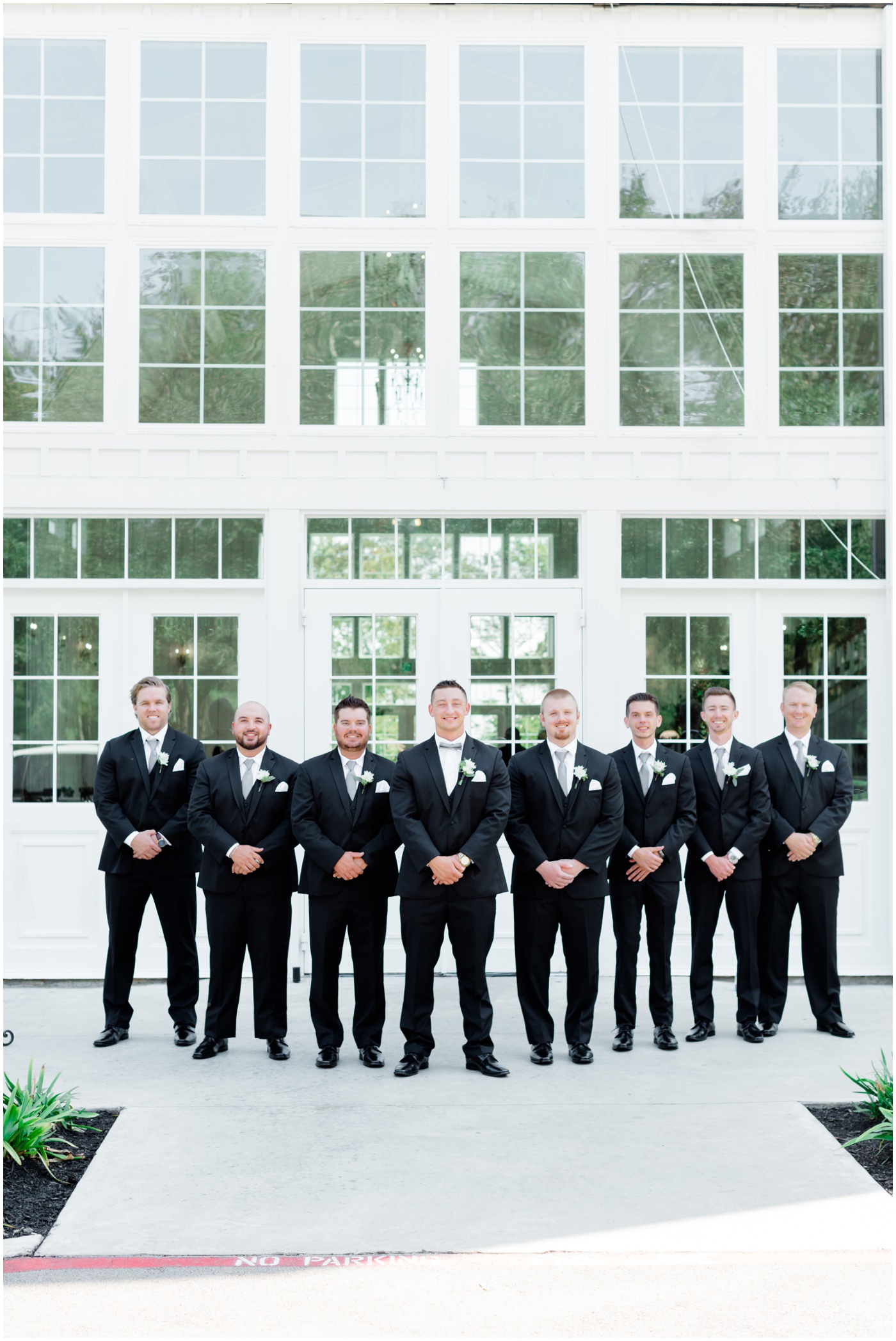a groom smiling with his groomsmen