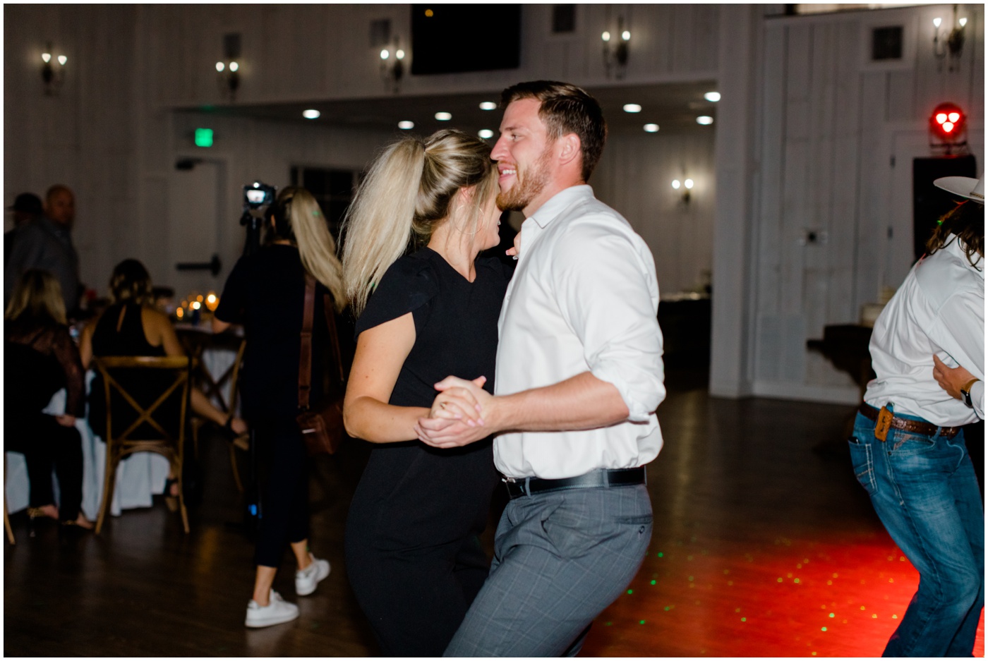 wedding guests dance together