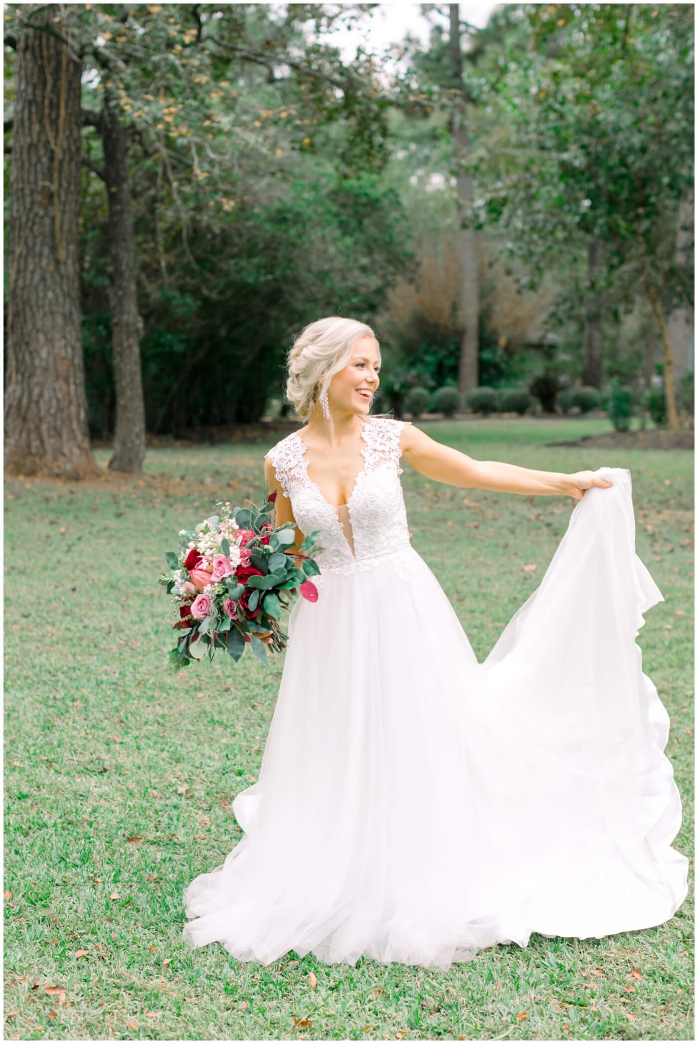 a bride smiles and twirls her wedding dress