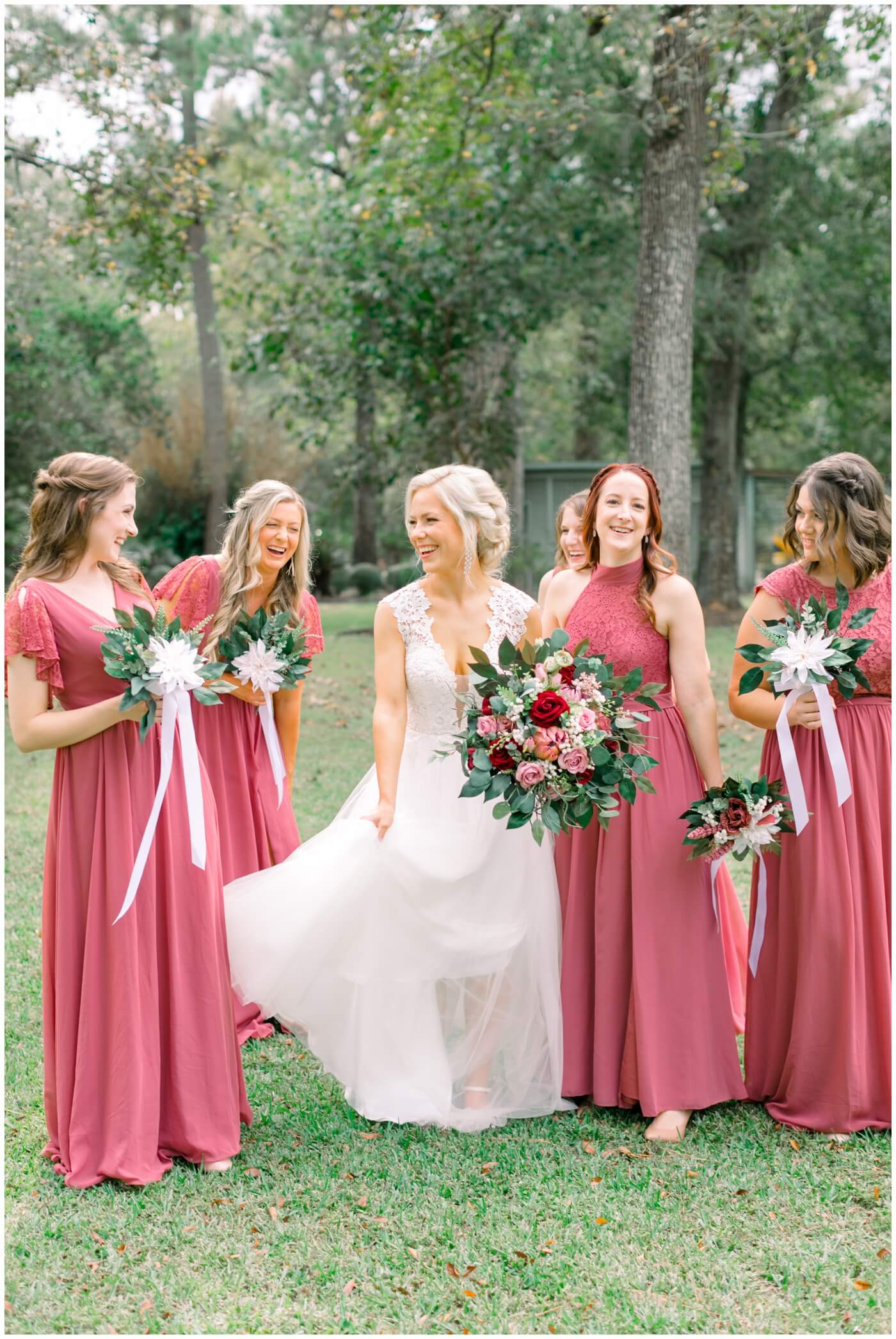 a bride laughs with her bridesmaids