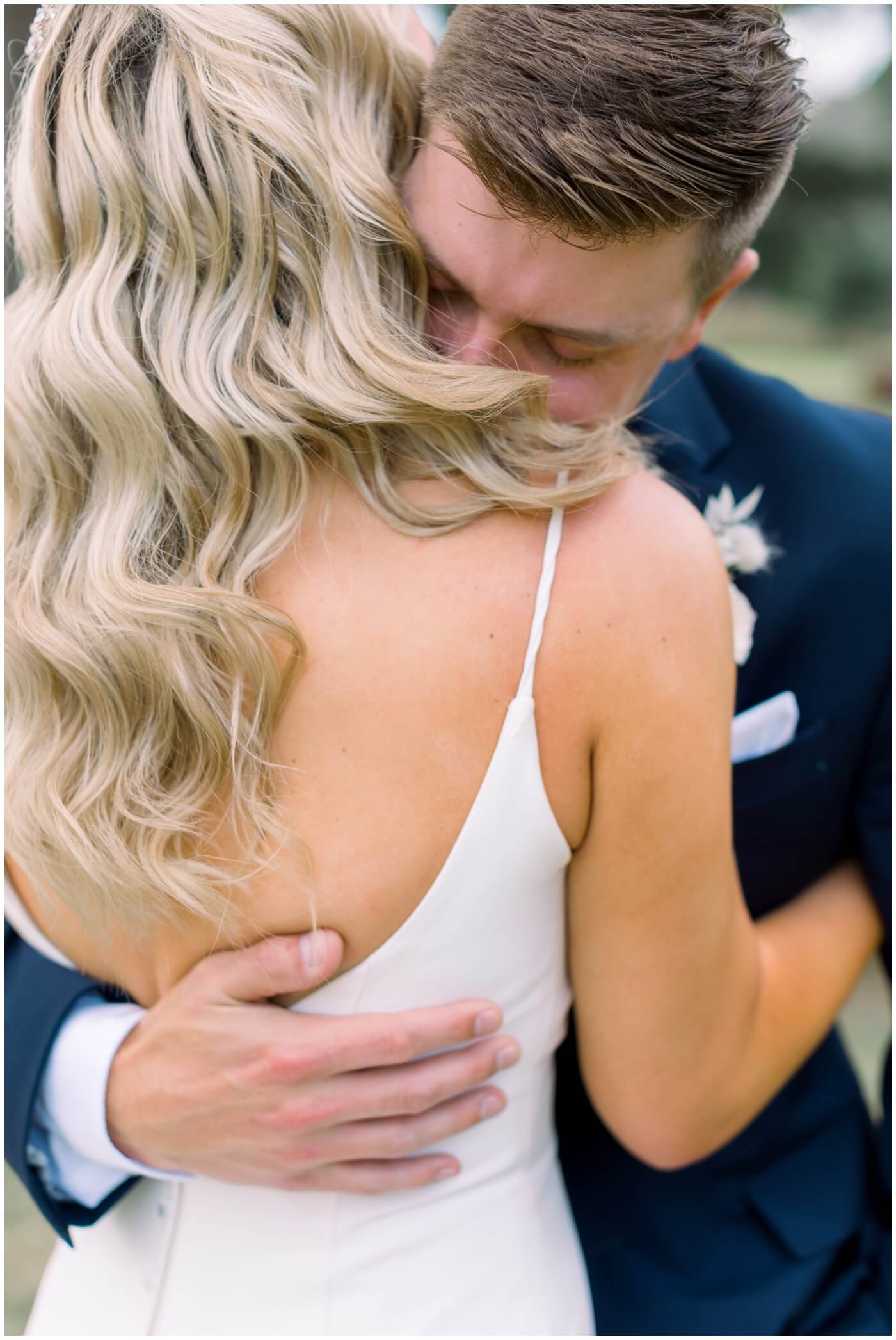 Houston Wedding at The Vine | the bride and groom hugging during their first look