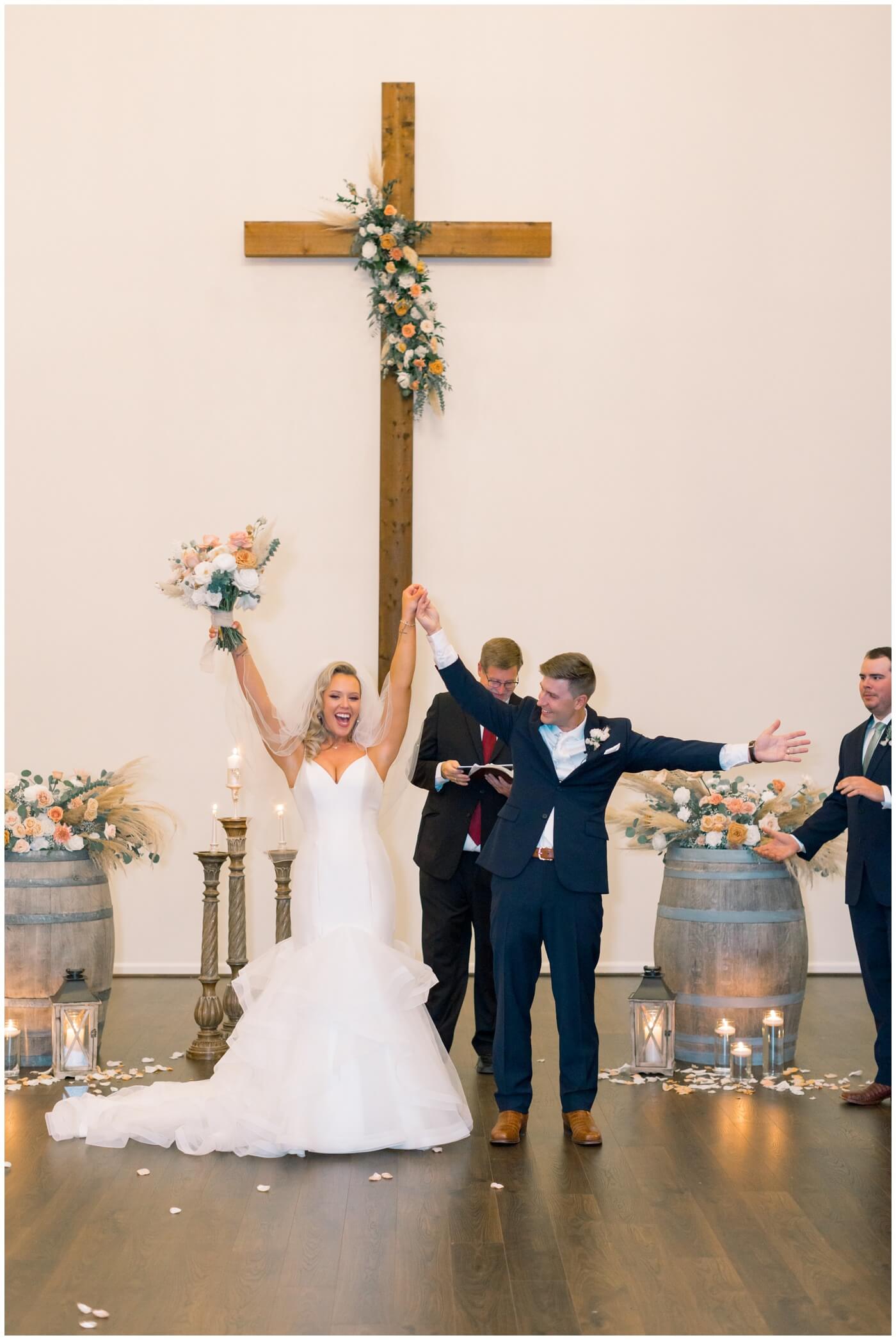 Houston Wedding at The Vine | the bride and groom celebrate after their wedding 
