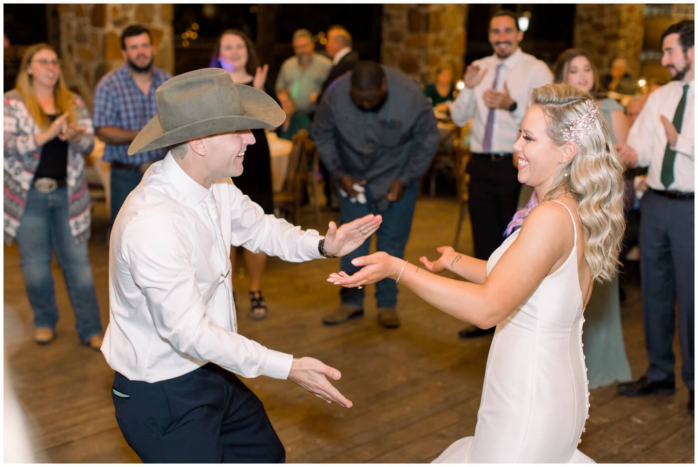 Houston Wedding at The Vine | the bride and groom laugh while dancing together
