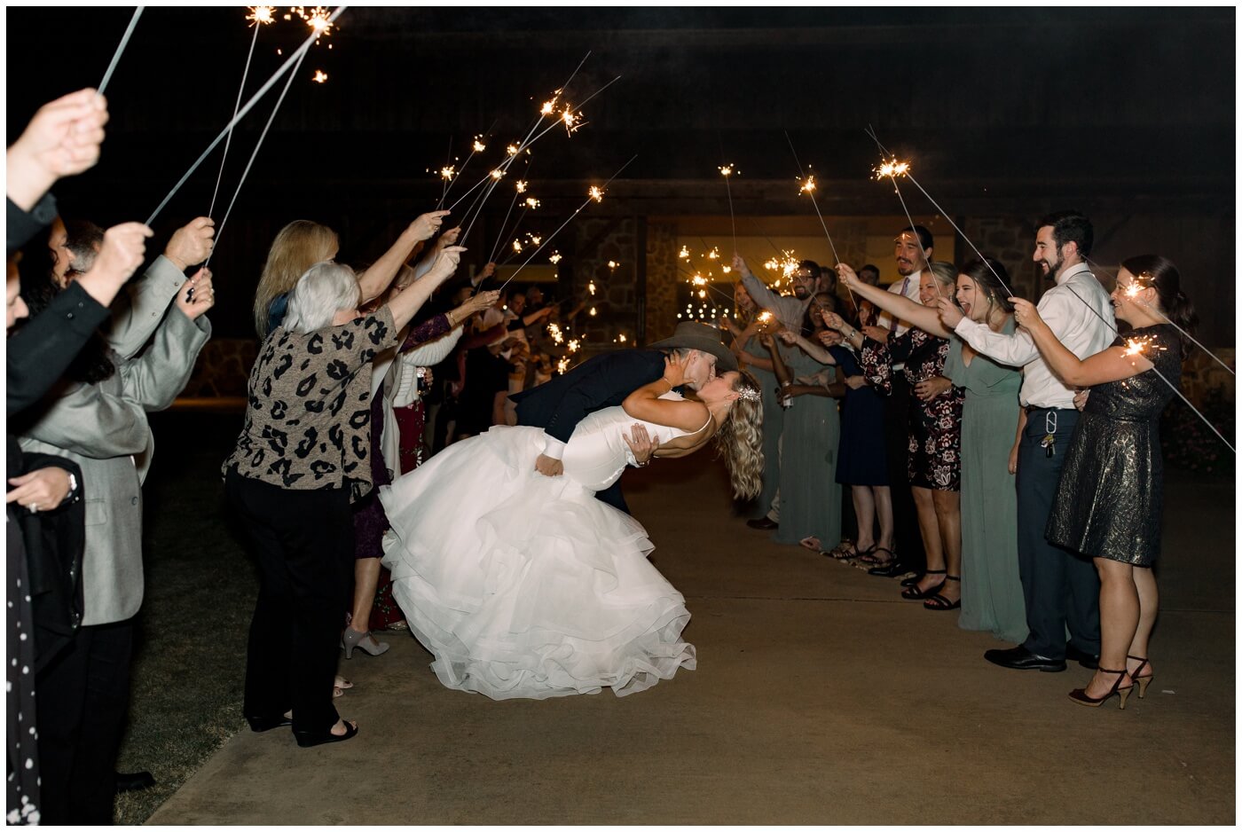 Houston Wedding at The Vine | the bride and groom dip and kiss with sparklers at their exit