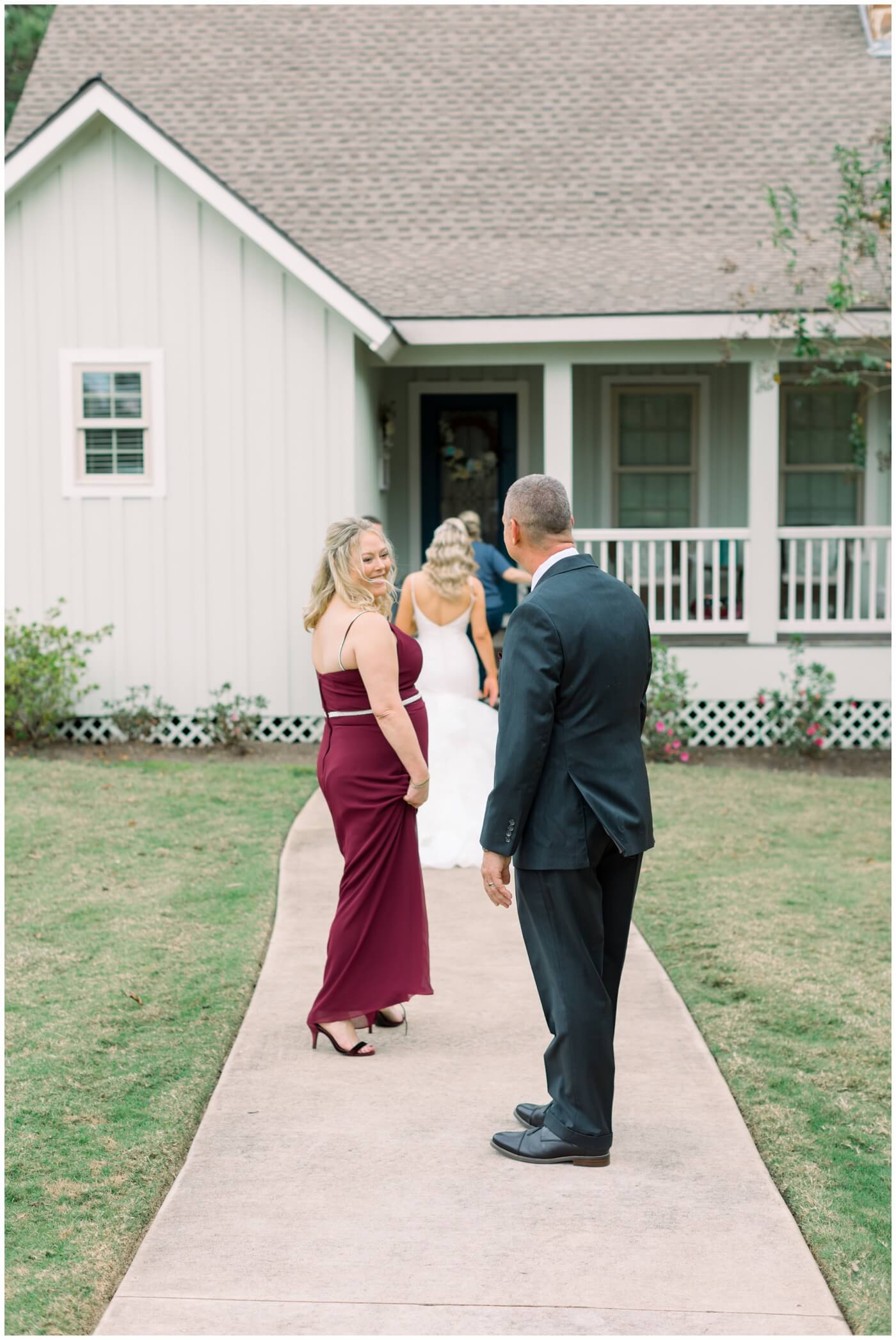 Houston Wedding at The Vine | the bride's parents looking at each other and smiling