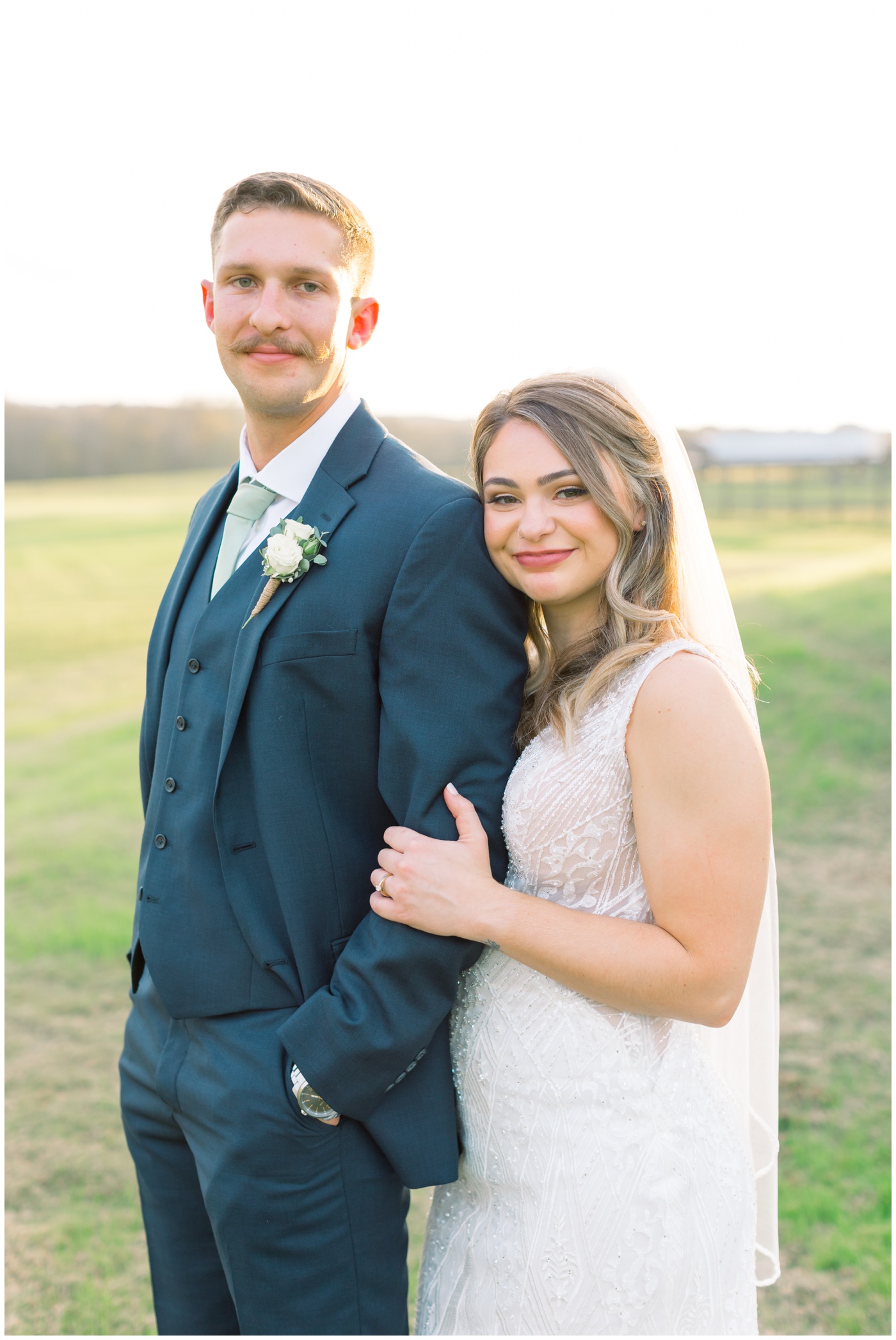 Texas farmhouse wedding | the bride and groom smile at sunset 