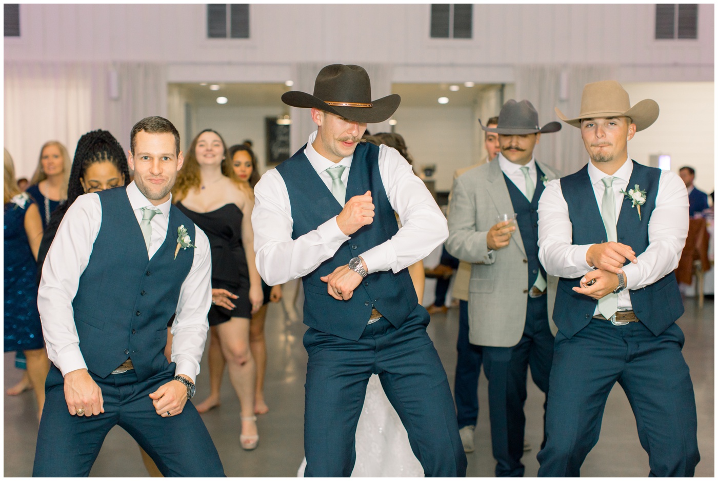 Texas Farmhouse wedding | the groom dances with his brothers 