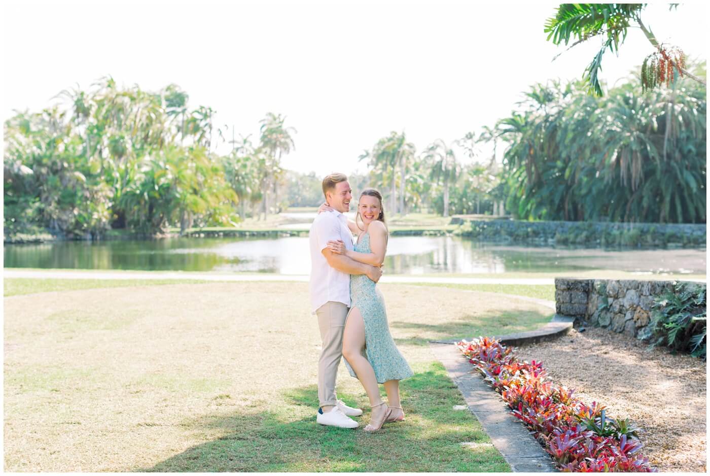 a couple dances at the botanical gardens in miami during their engagement session.