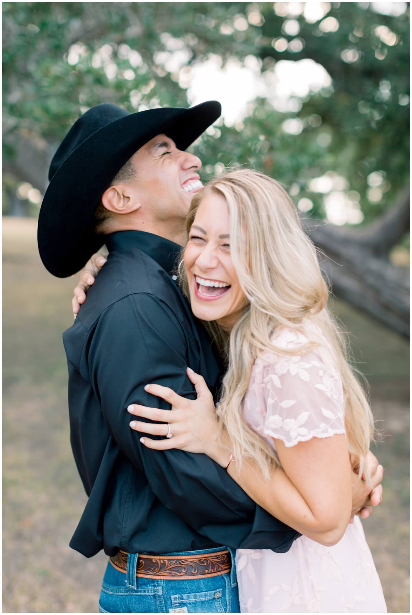 Engagement photos in Houston. A couple laughs together.