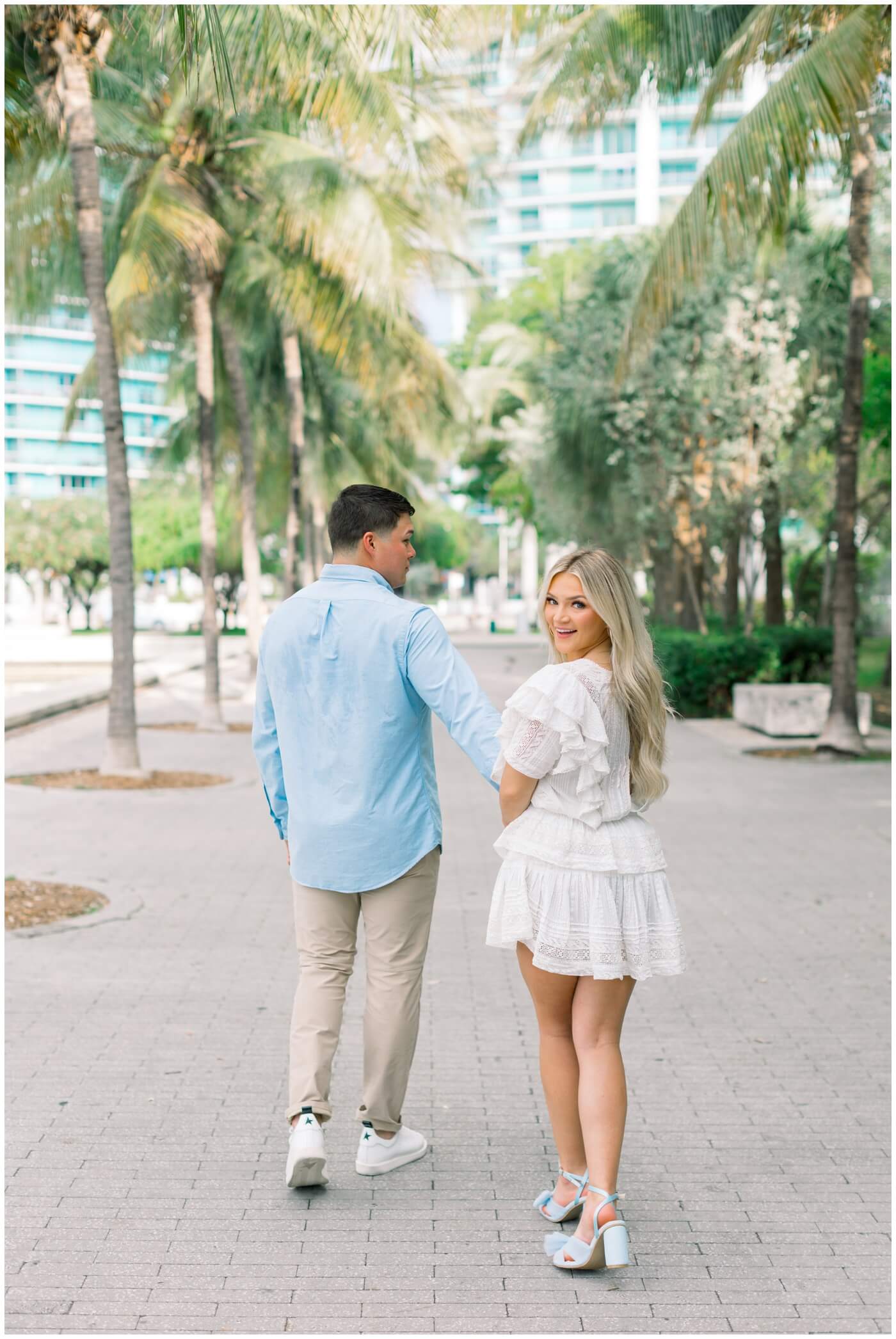 Couple walks together in downtown Miami engagement photos