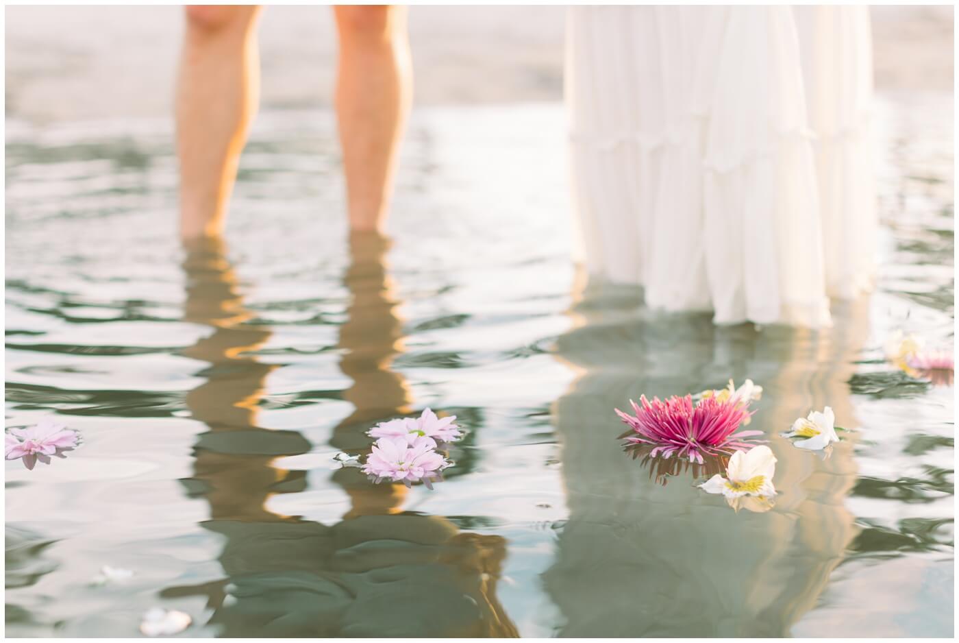 Flowers float in the water on the beach in Miami