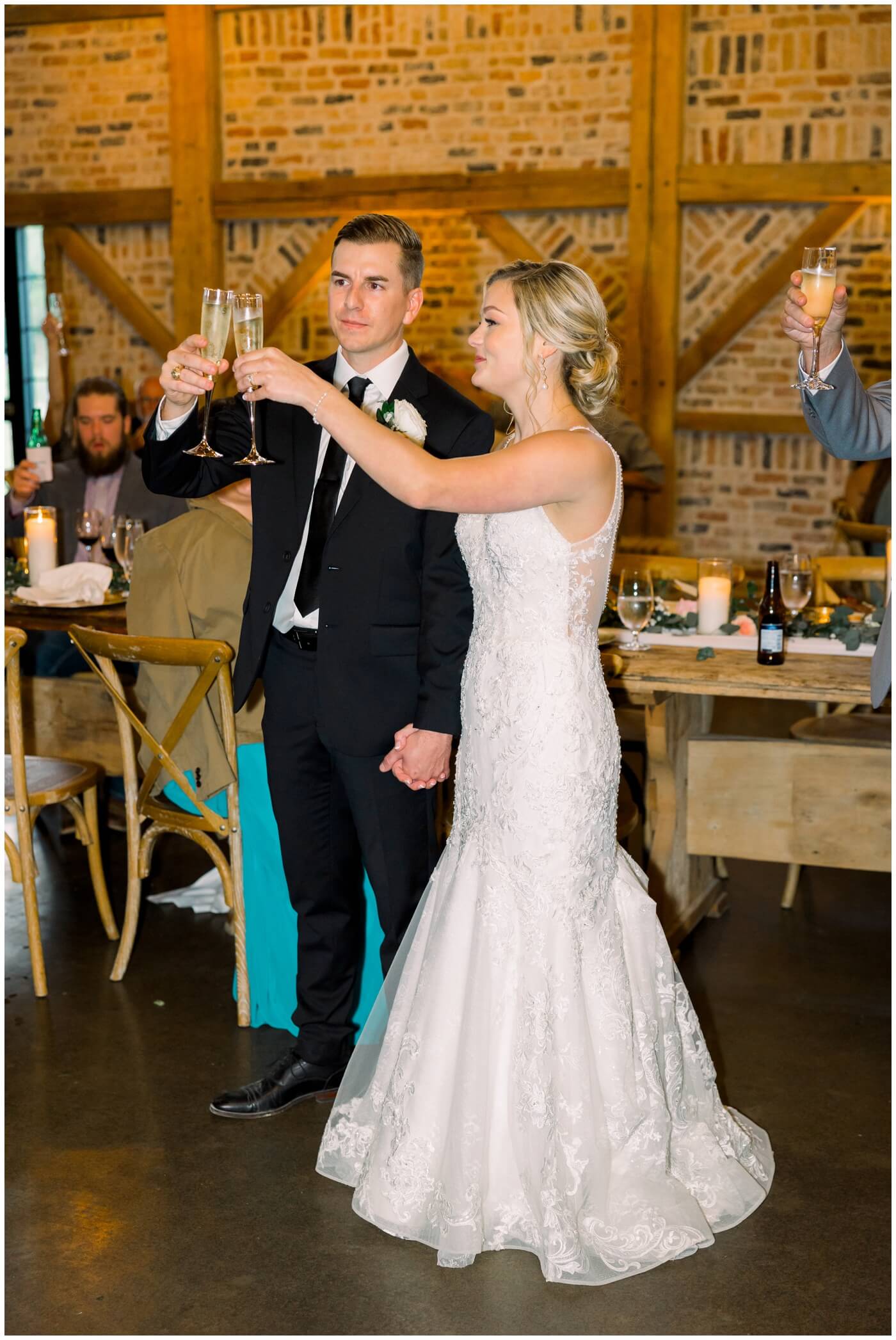 The couple toast as they listen to loved ones share a speech