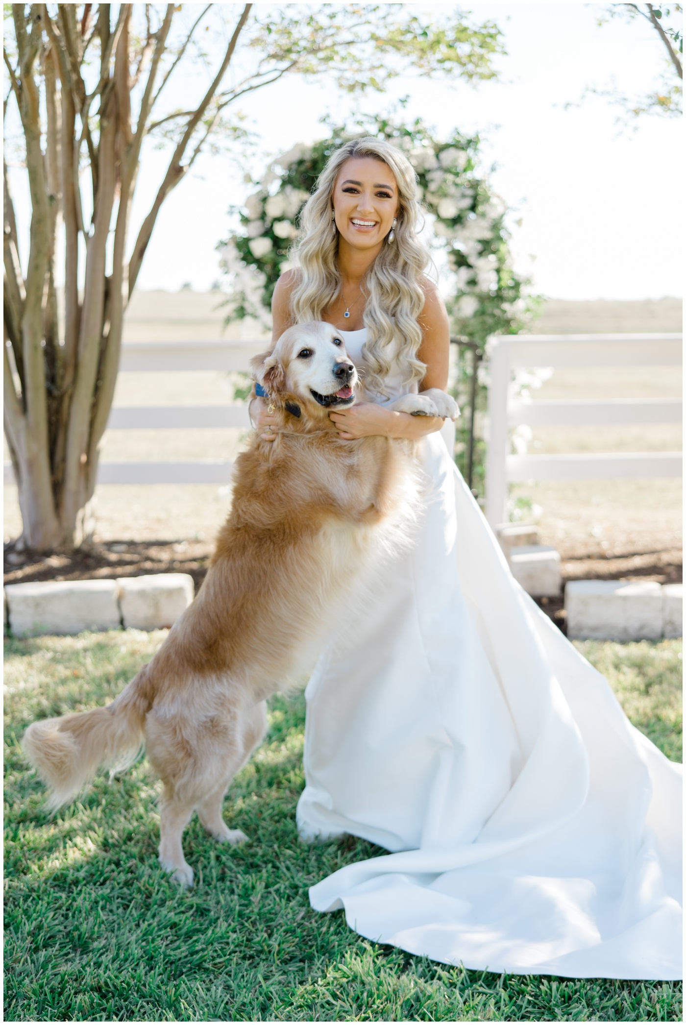 Texas Wedding Photographer | A bride smiles with her dog on her wedding day