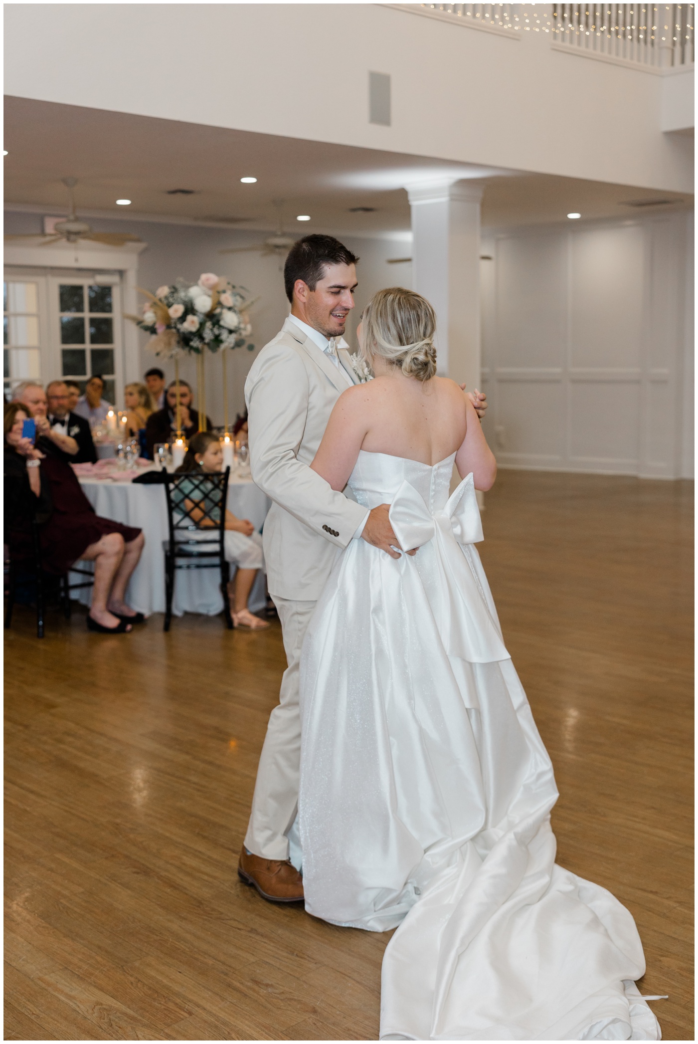 The bride and groom share their first dance
