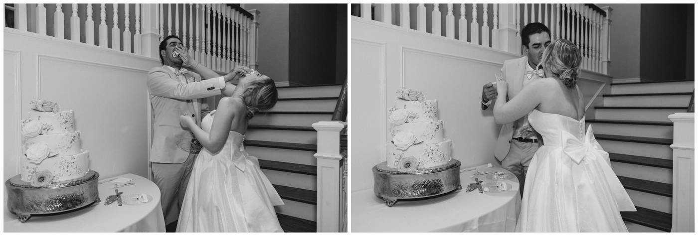 The bride and groom cut their wedding cake.
