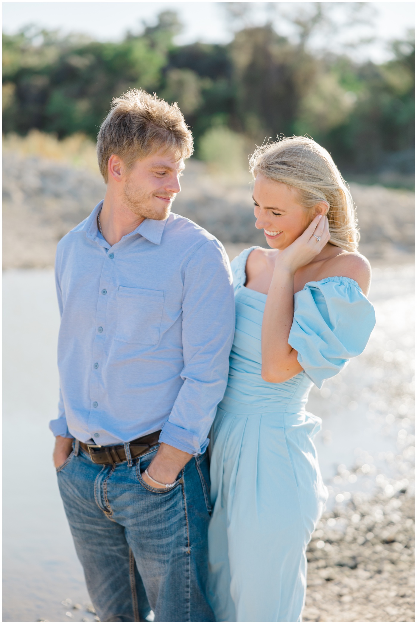 A couple smile together during their waco engagement session