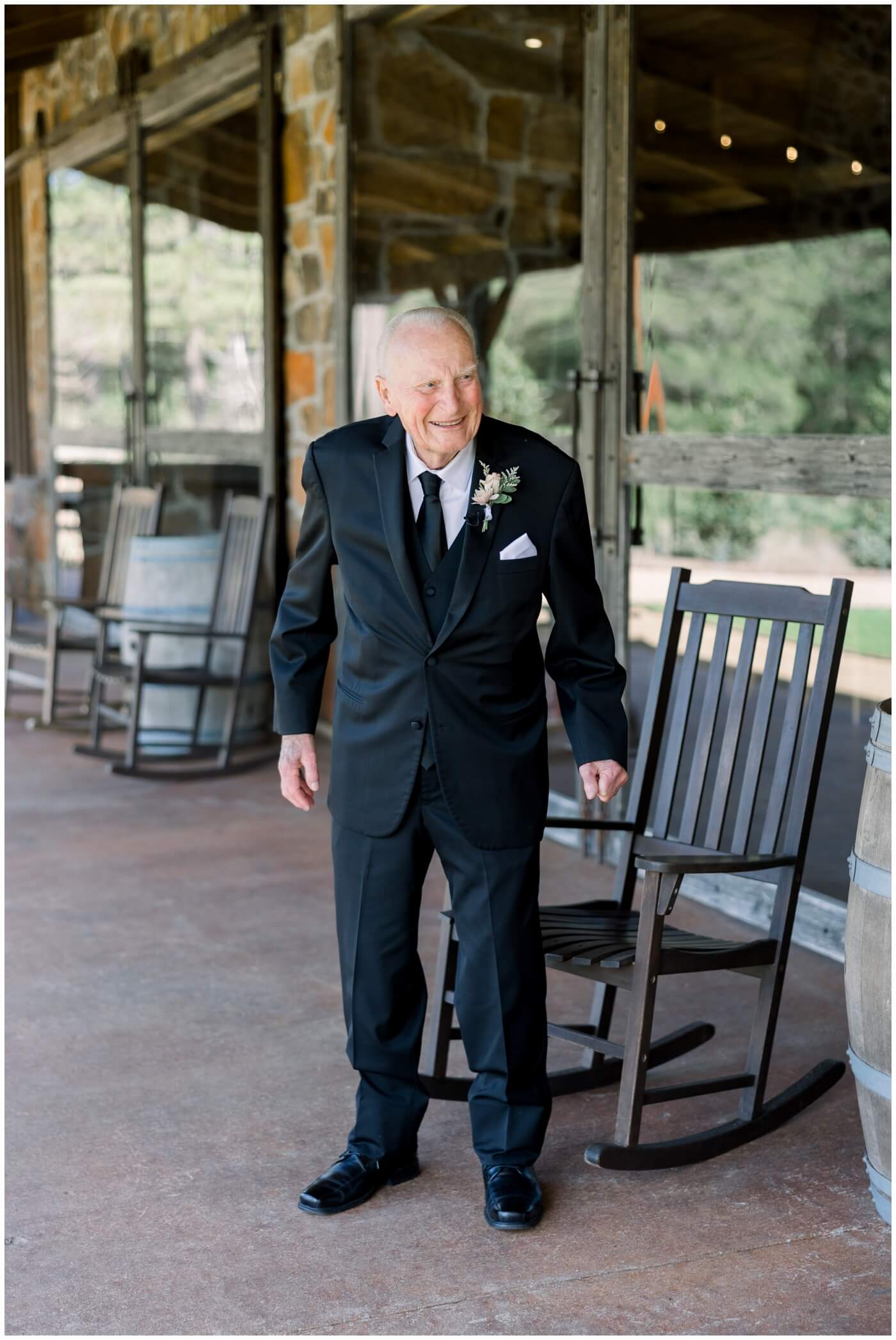 A bride shares a first look with her grandfather on her wedding day.