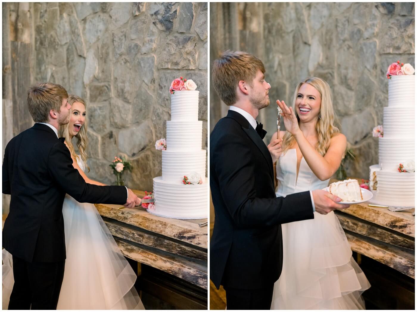 Bride and groom smile as they cut the cake