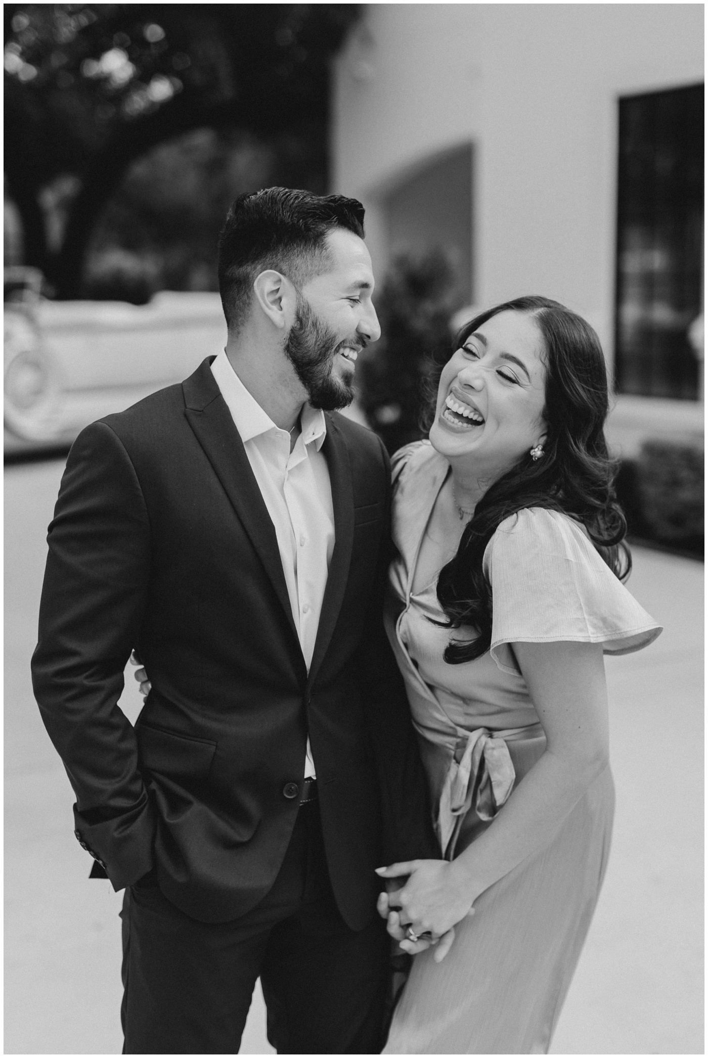 A couple laughs together at the Peach Orchard Venue