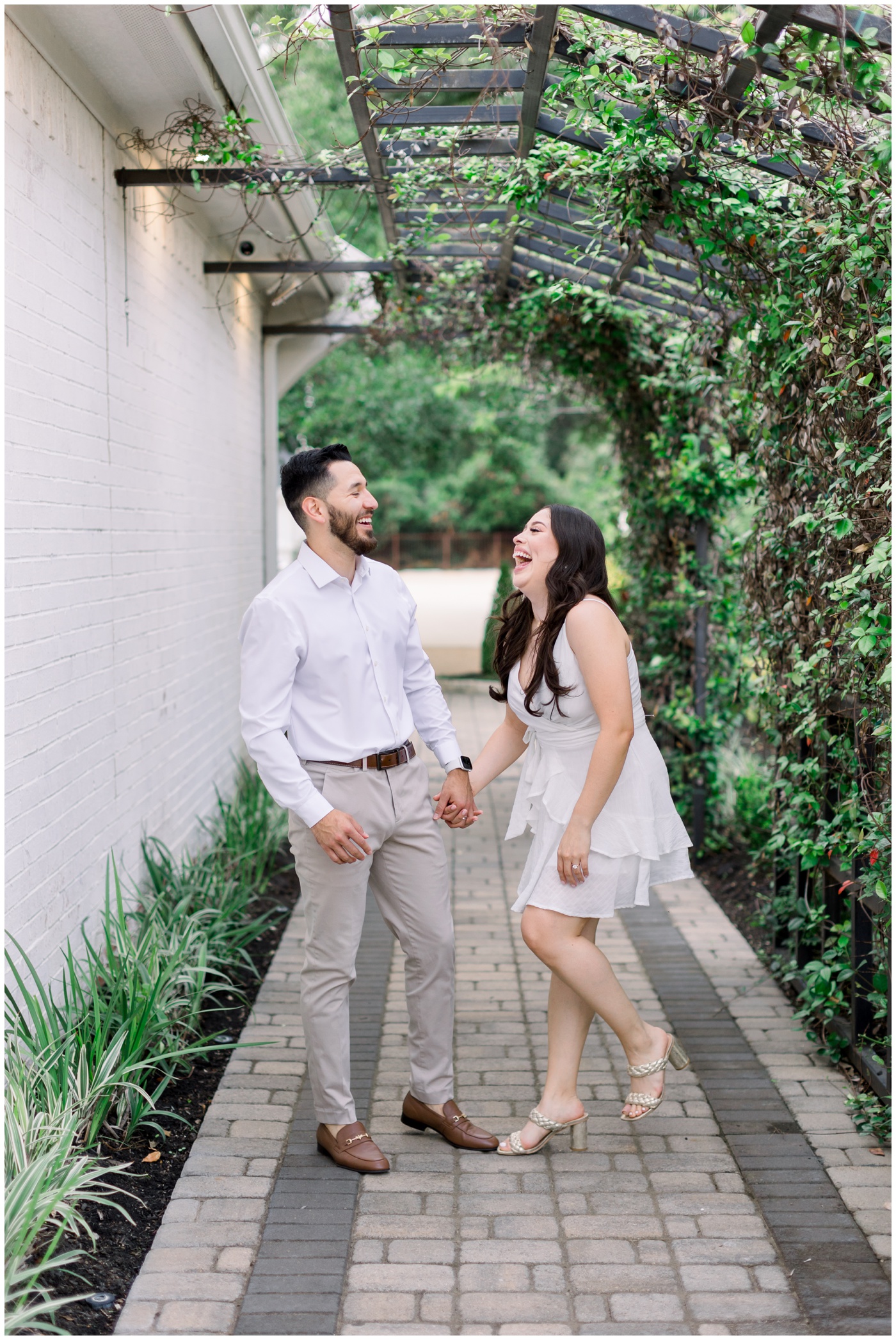 A couple laughs together at the Peach Orchard Venue.