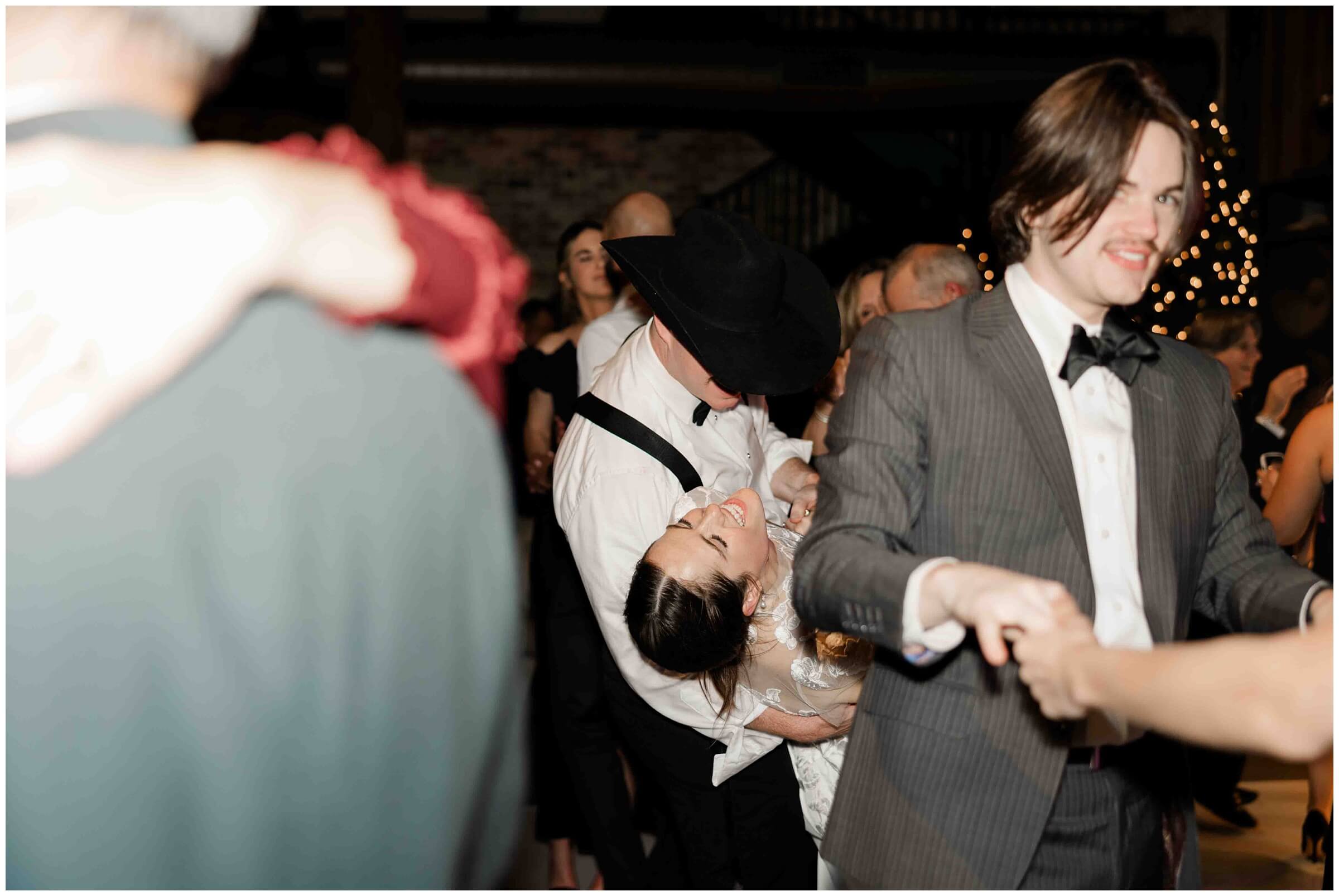 Guests dance at the wedding reception