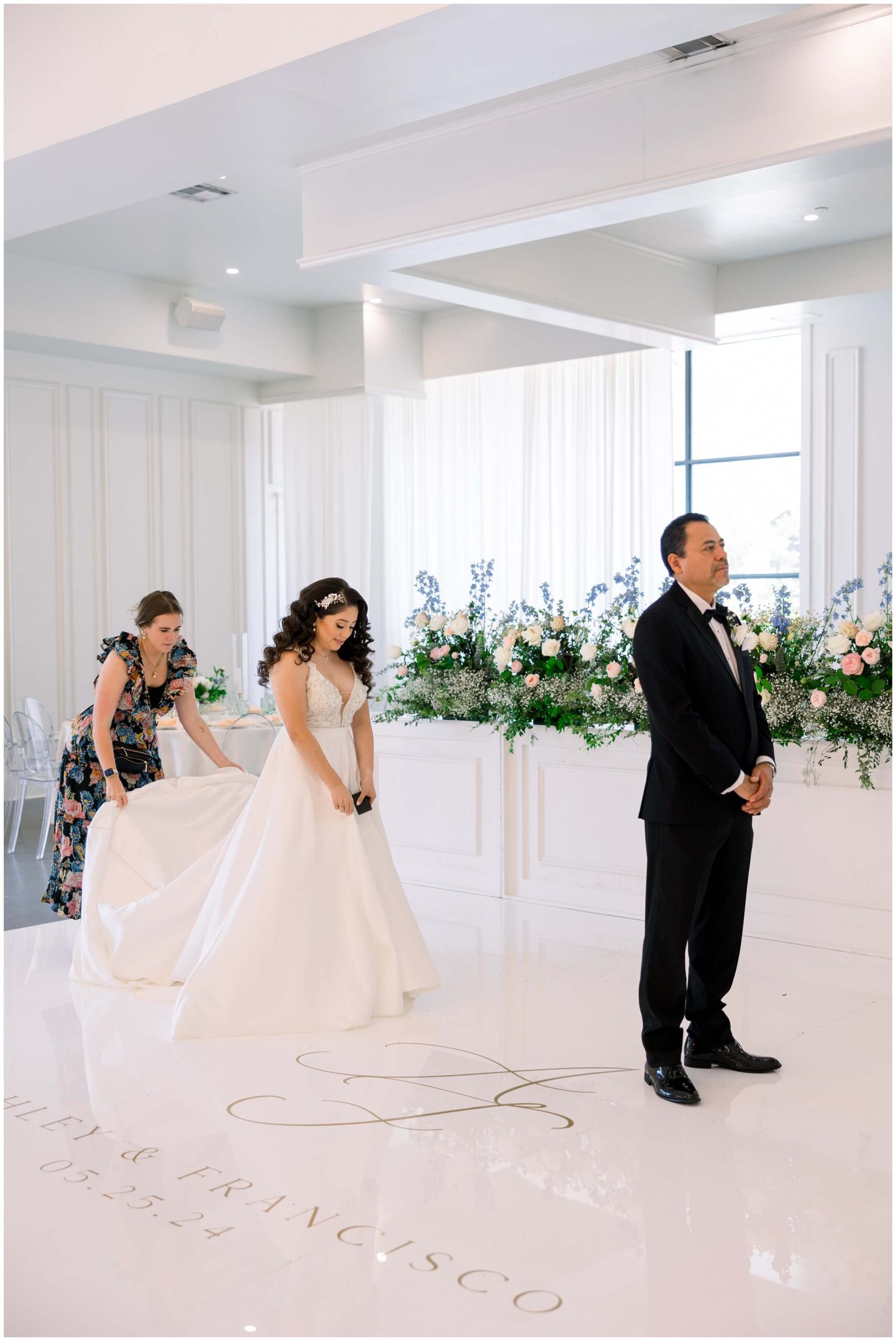 The bride shares a first look with her father at the Peach Orchard venue