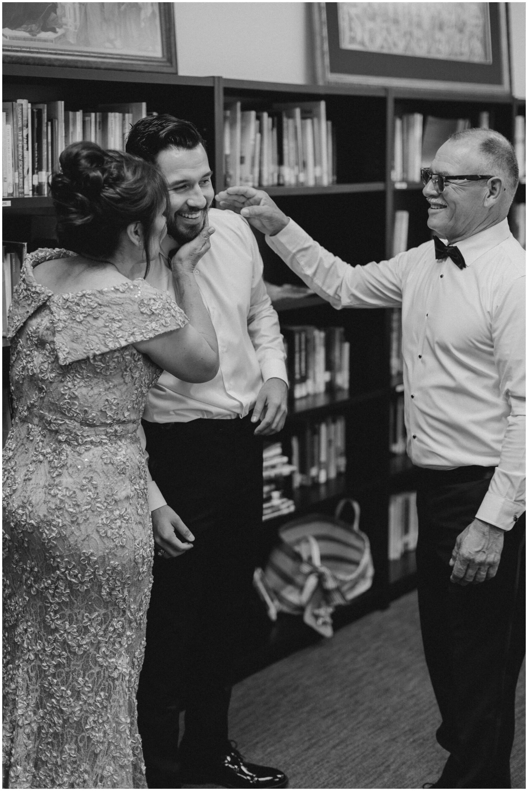 the groom gets ready with his family at saint john vianney catholic church