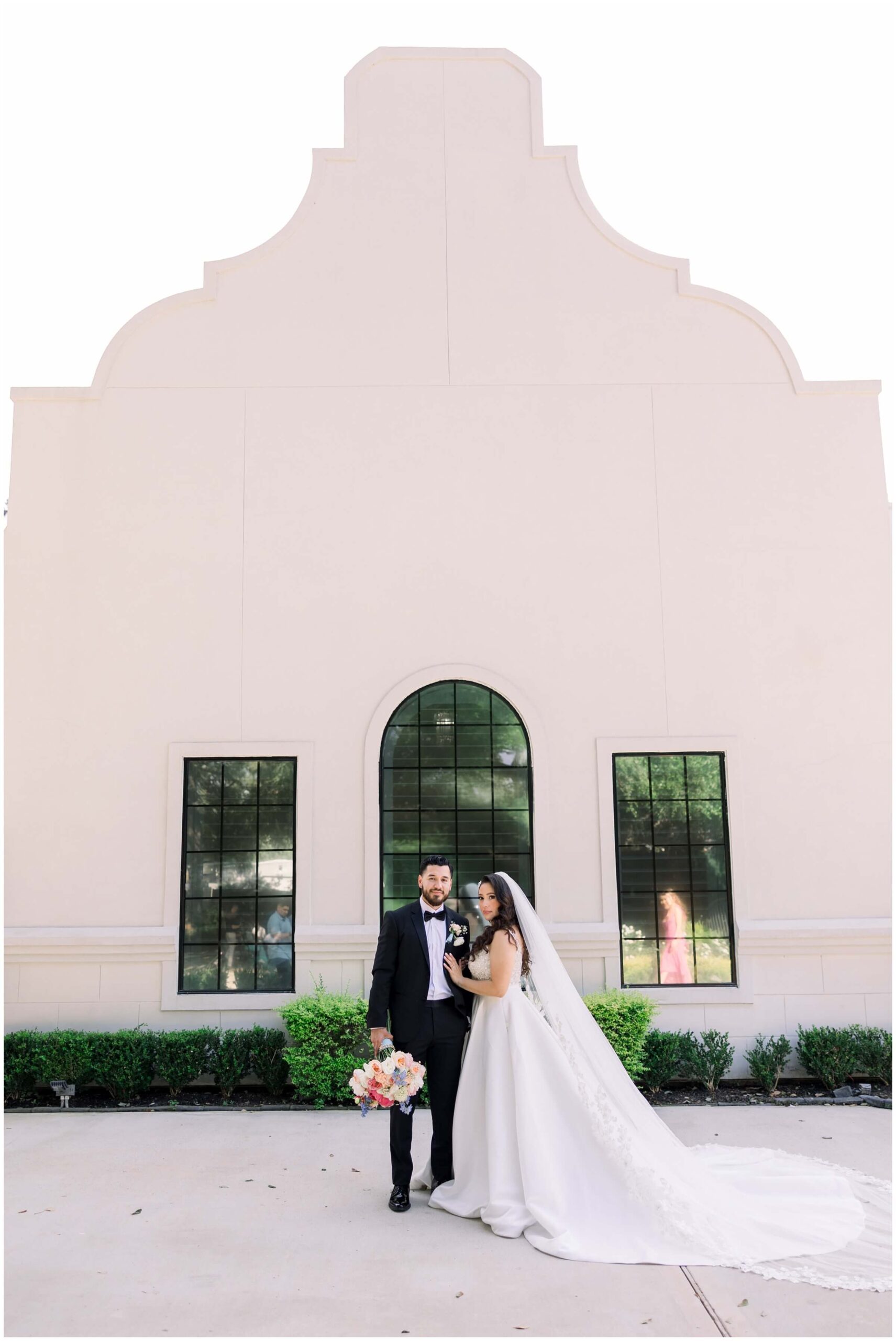 The bride and groom smile together at the Peach Orchard venue