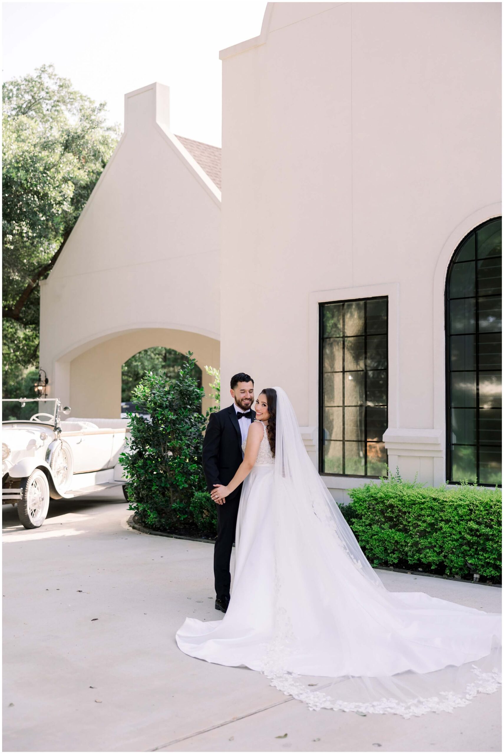 The bride and groom smile together at the Peach Orchard venue