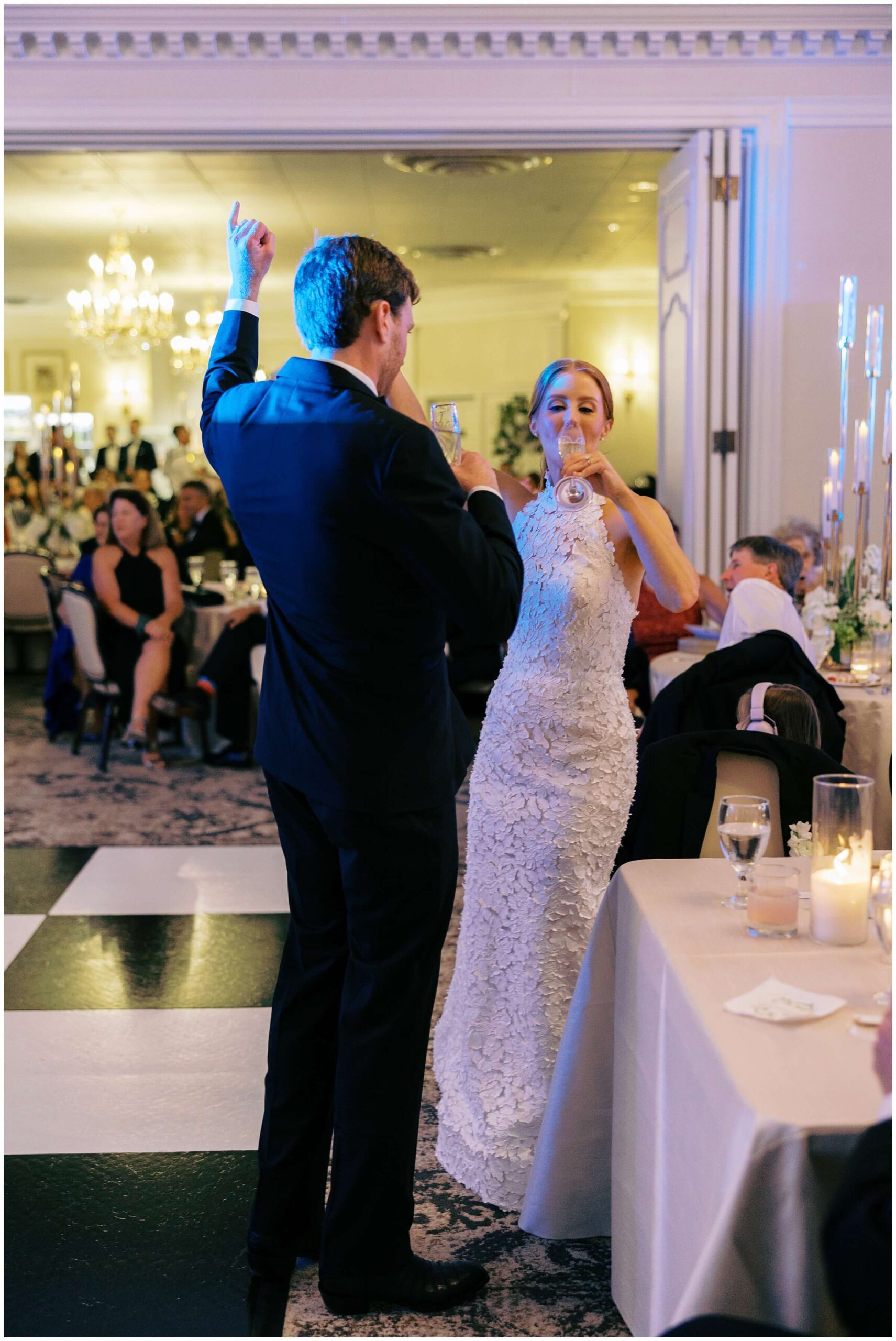 Bride and groom dancing surrounded by guests at Colonial Country Club wedding