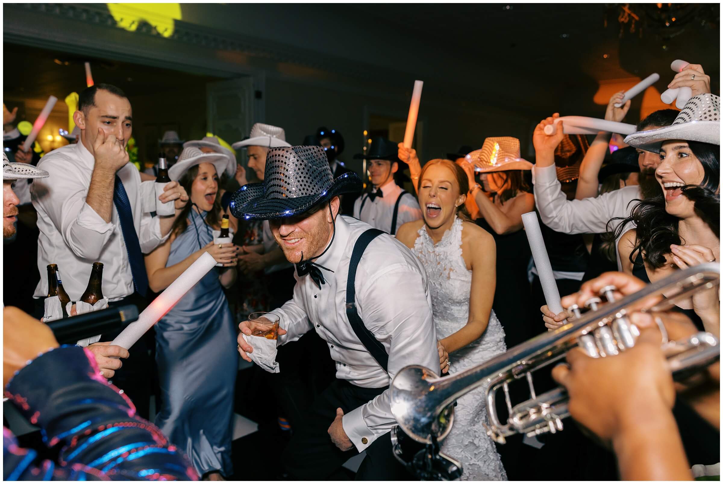 Bride and groom dancing surrounded by guests at Colonial Country Club wedding