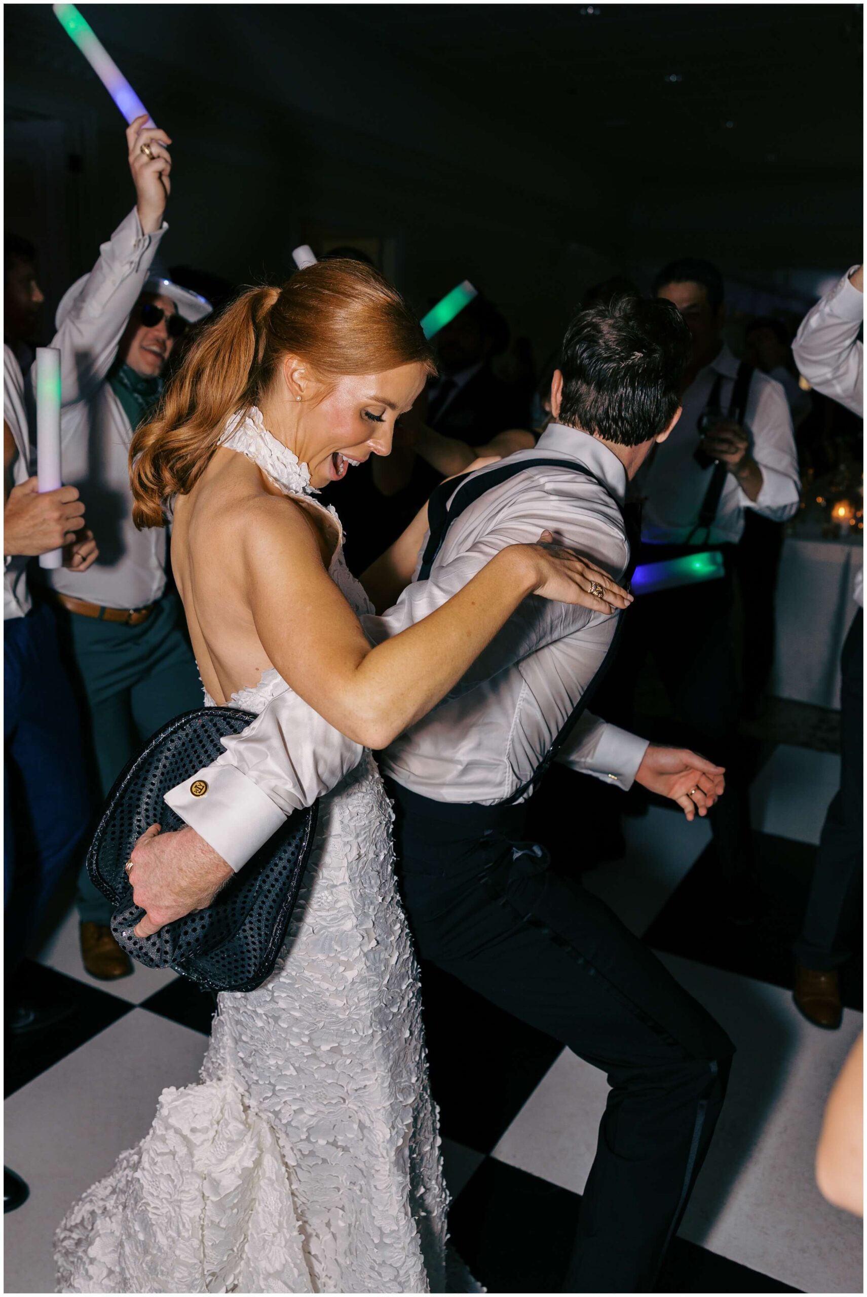 Bride and groom dancing surrounded by guests at Colonial Country Club wedding