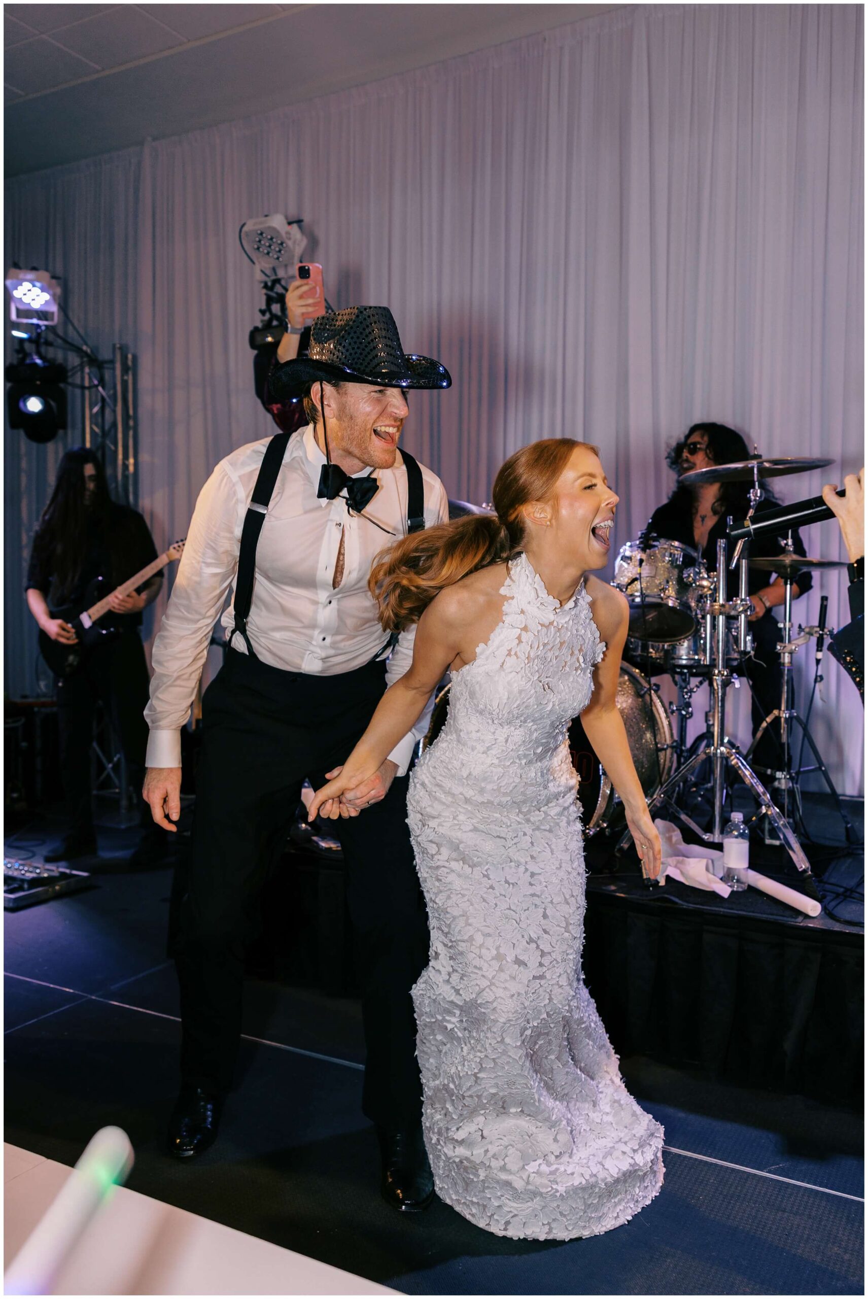 Bride and groom dancing surrounded by guests at Colonial Country Club wedding
