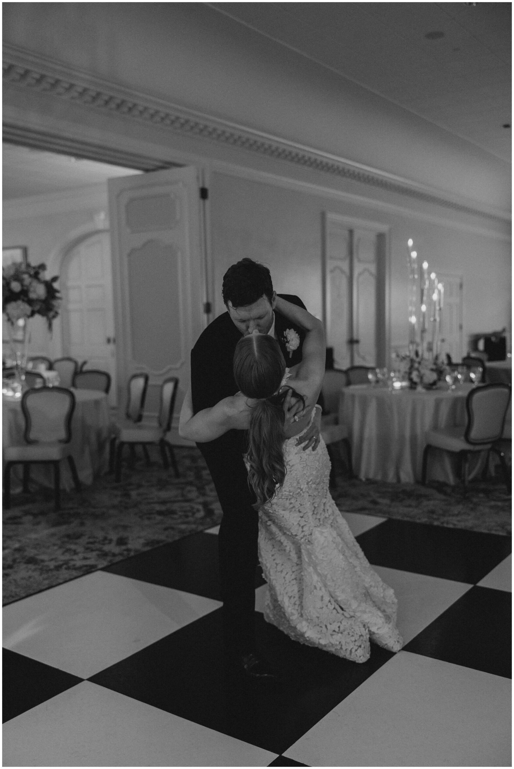 Bride and groom dancing surrounded by guests at Colonial Country Club wedding