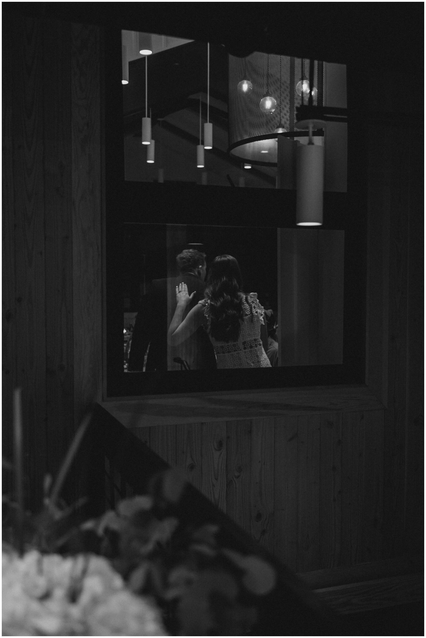 Maddie and Tucker celebrating with family during their rehearsal dinner at Sixty Vines in The Woodlands — photographed by Westy Peck, Houston wedding photographer.
