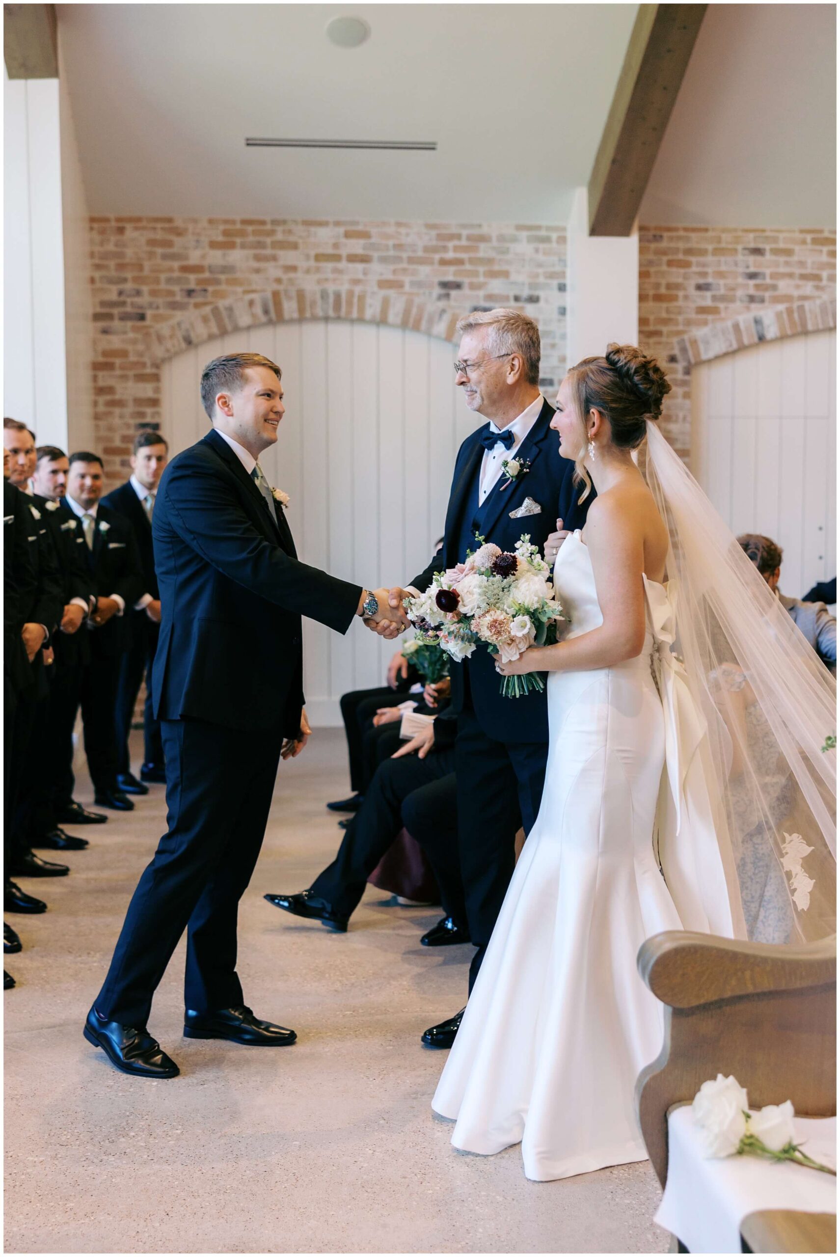 Ceremony at The Blue Magnolia featuring colorful florals by Rose and Rae.