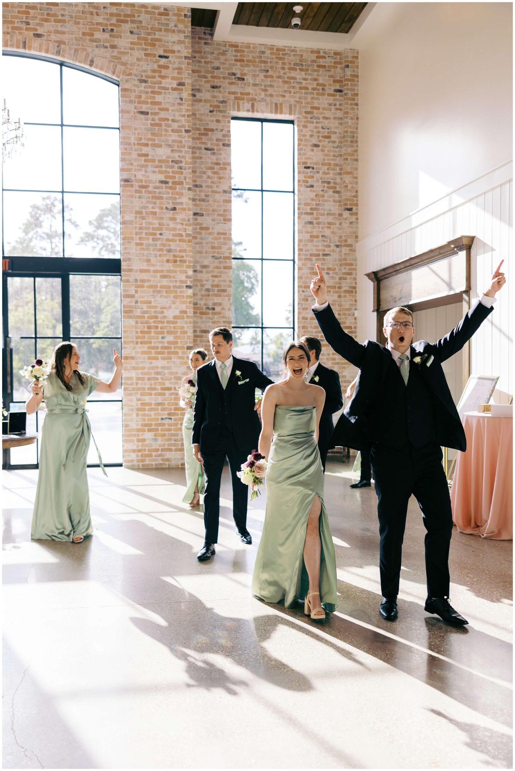 Ceremony at The Blue Magnolia featuring colorful florals by Rose and Rae.