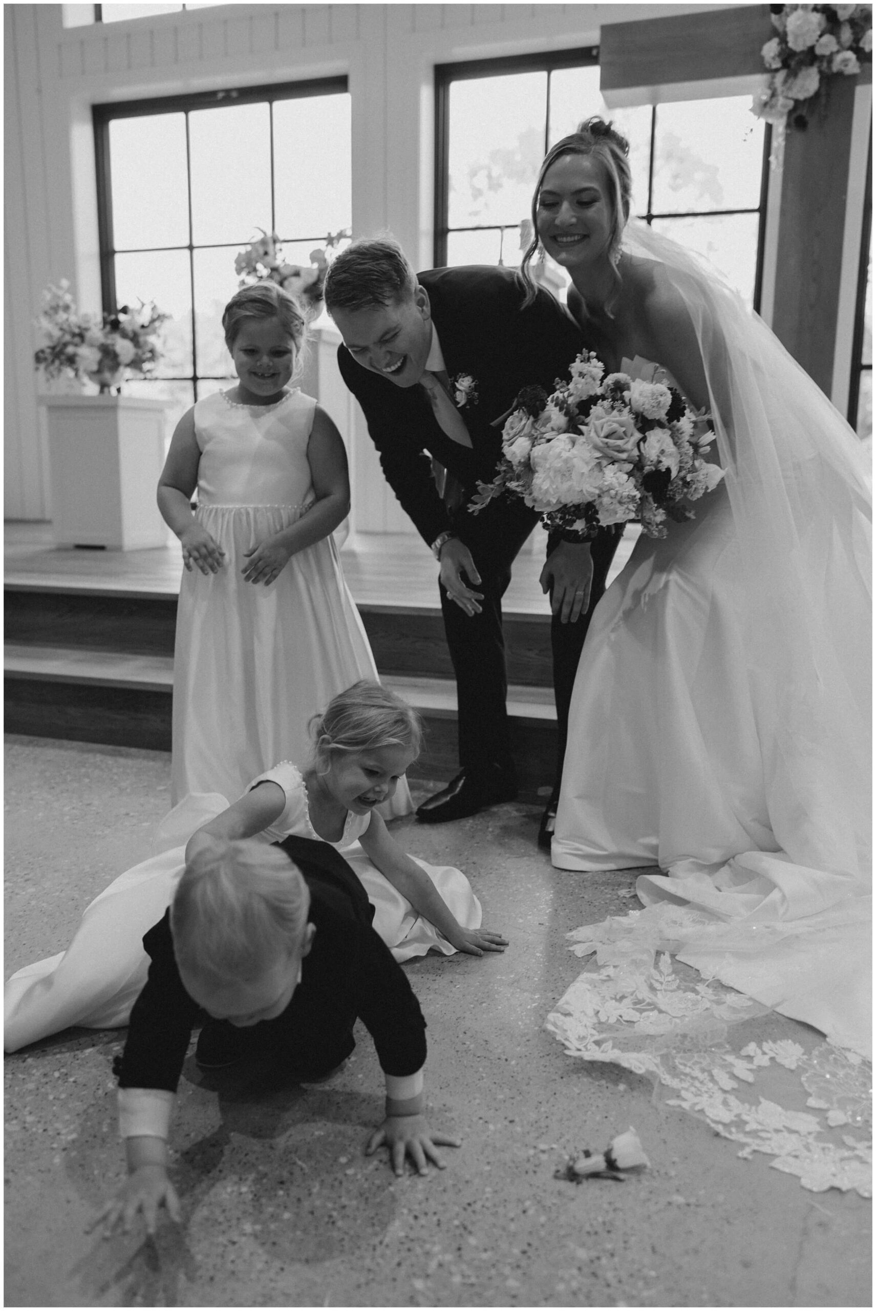 Ceremony at The Blue Magnolia featuring colorful florals by Rose and Rae.