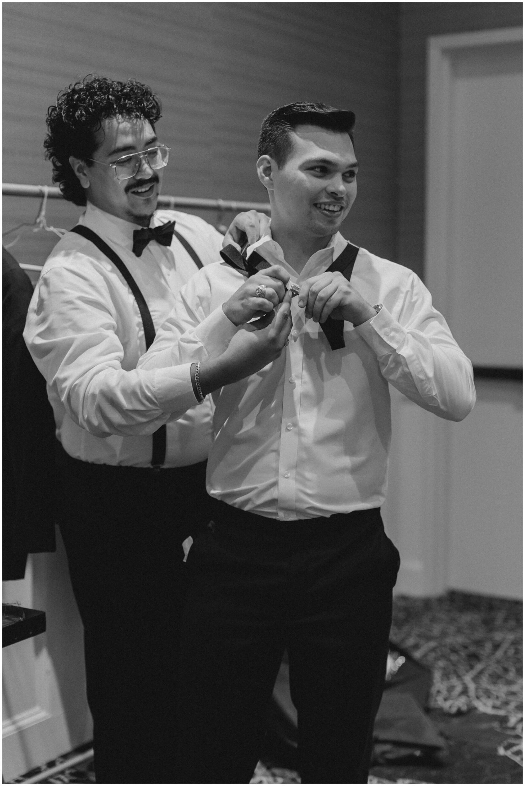 a groom and his groomsmen getting ready at the omni barton creek