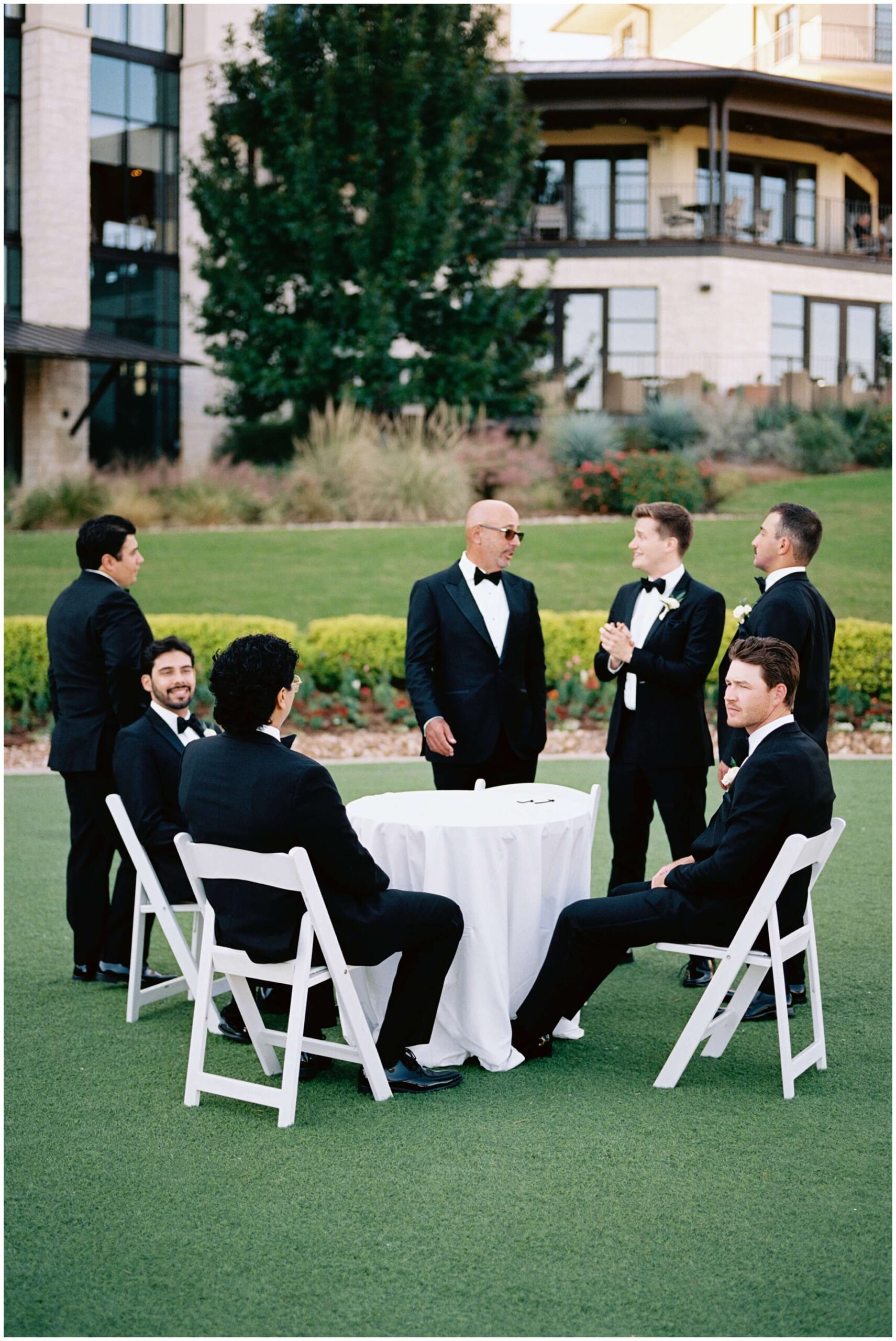 a groom and his groomsmen getting ready at the omni barton creek