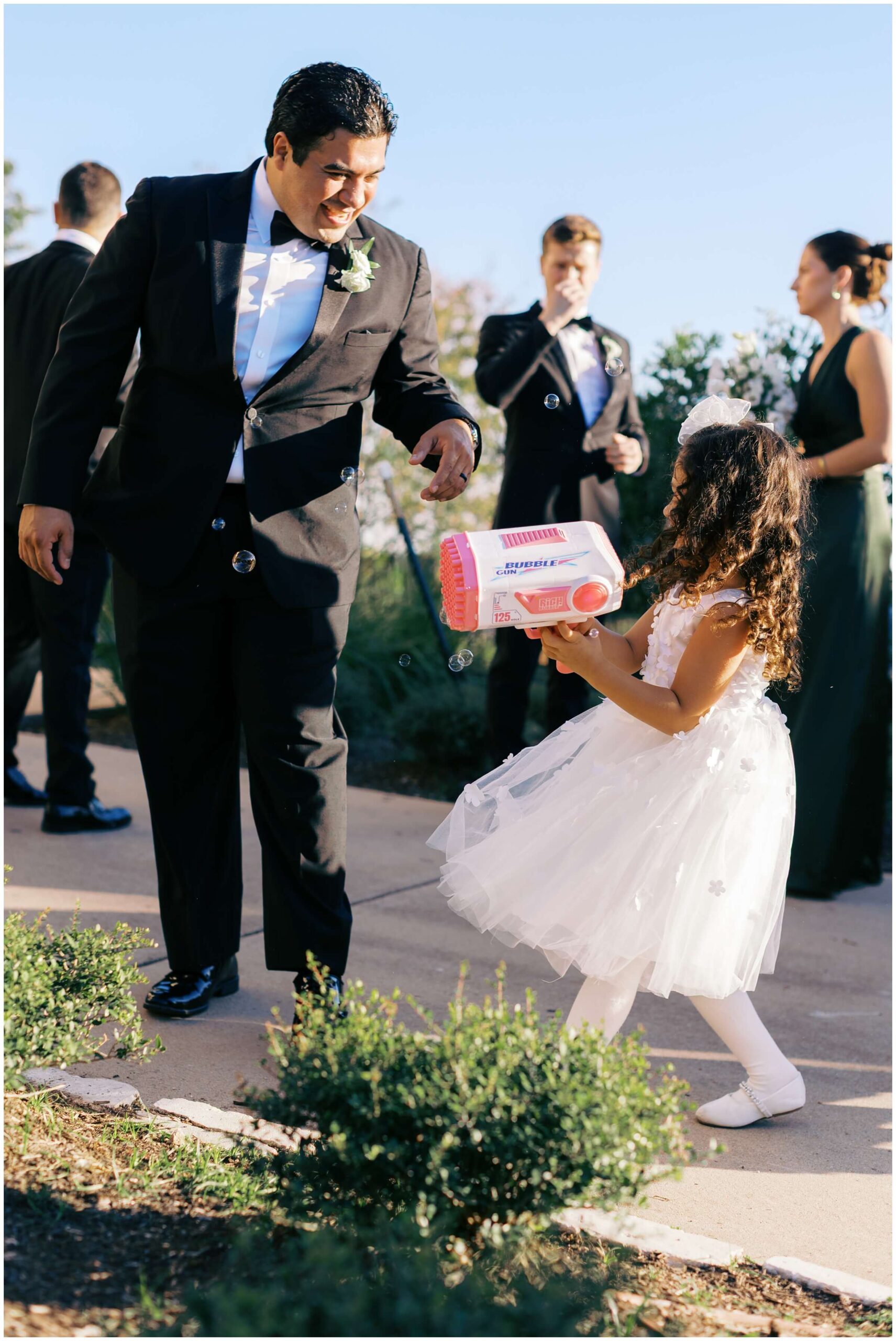 A bride and groom celebrate with their wedding party in Austin, Texas