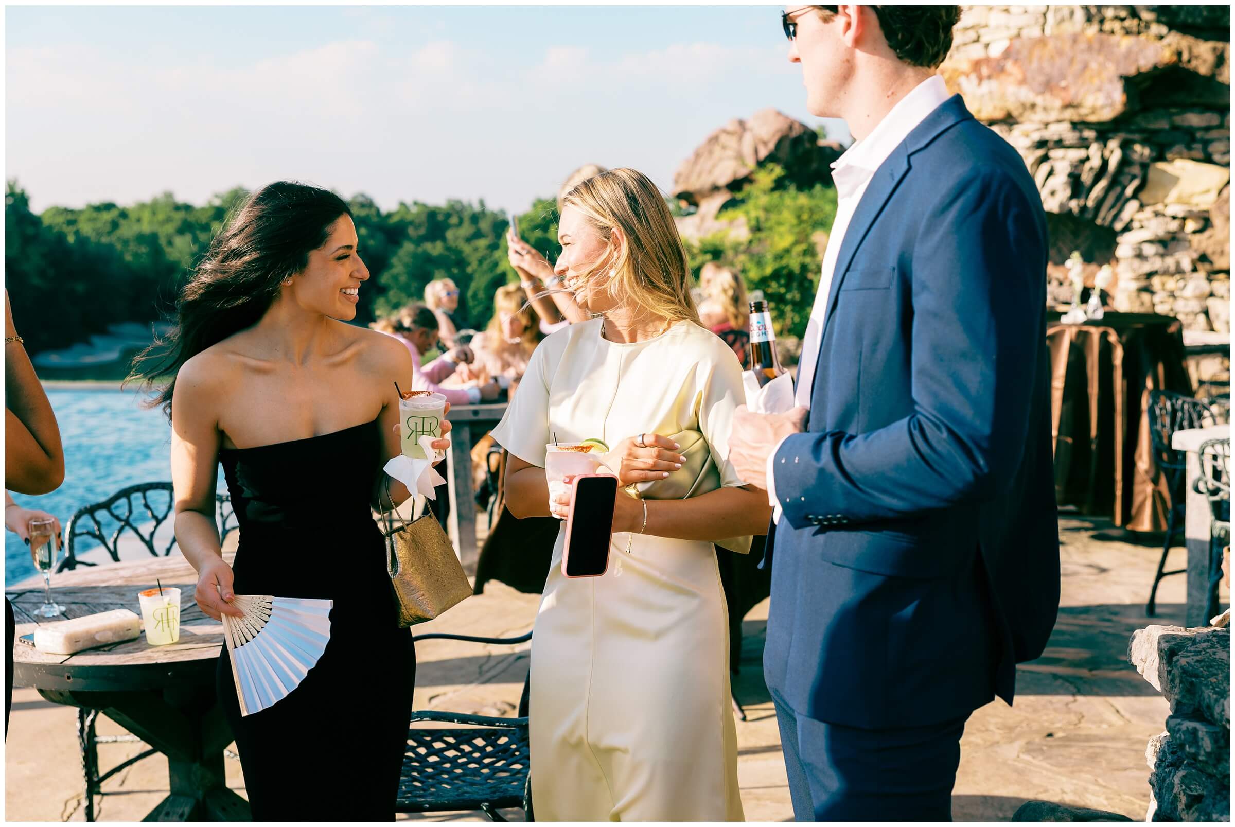 Destination Wedding photographer | Guests celebrating the couple at the wedding reception at the wine cellar of top of the rock