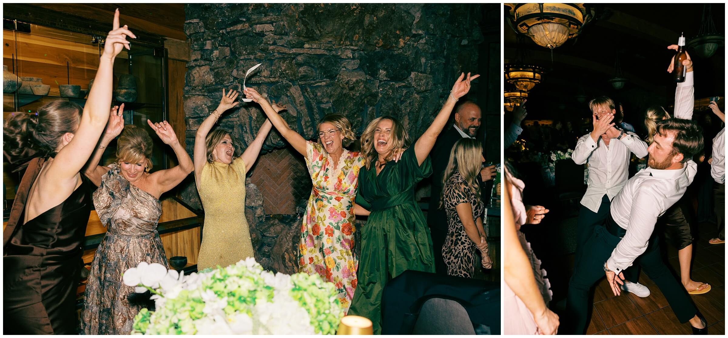 Destination Wedding photographer | Guests celebrating the couple at the wedding reception at the wine cellar of top of the rock