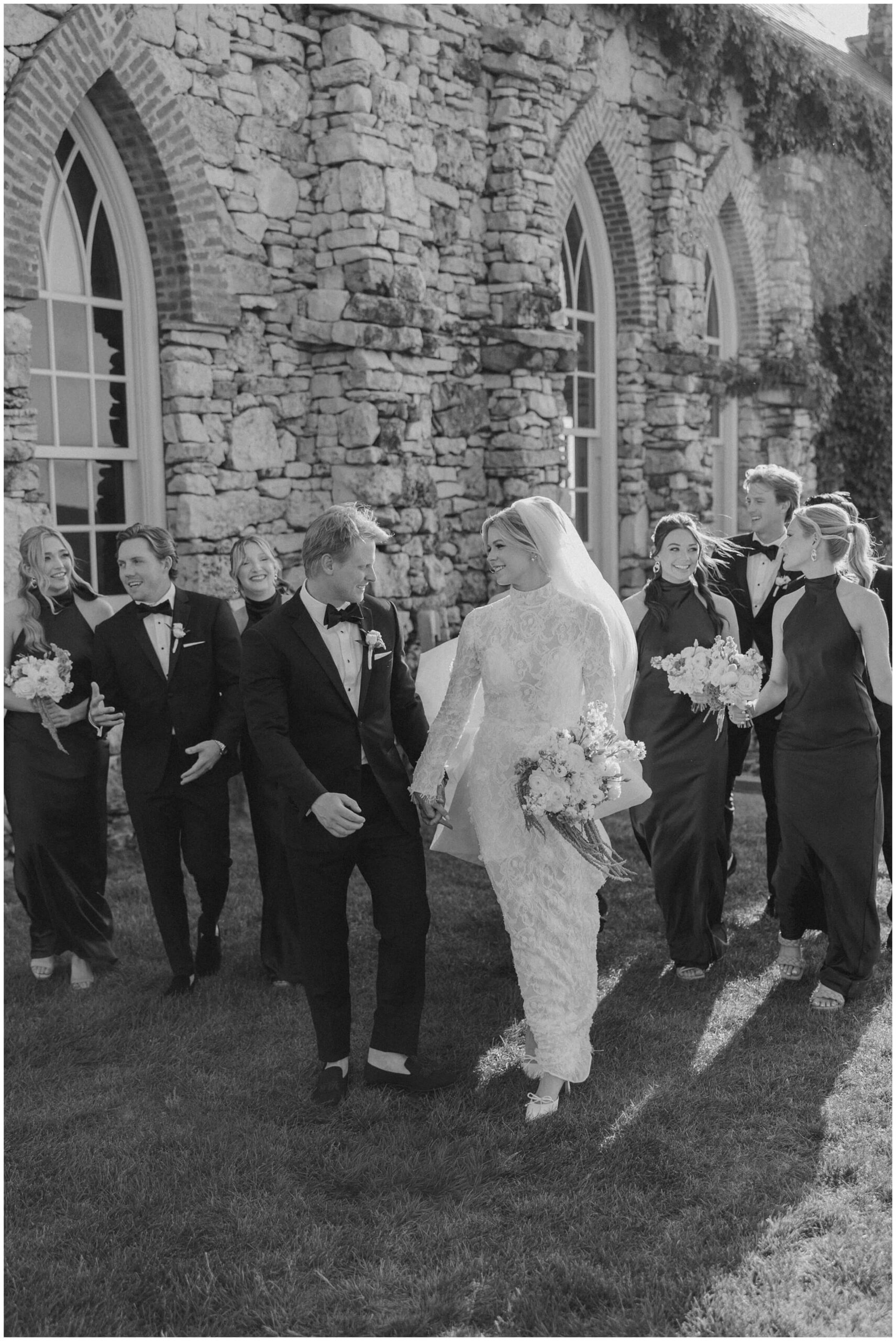 The wedding party celebrating at top of the rock chapel